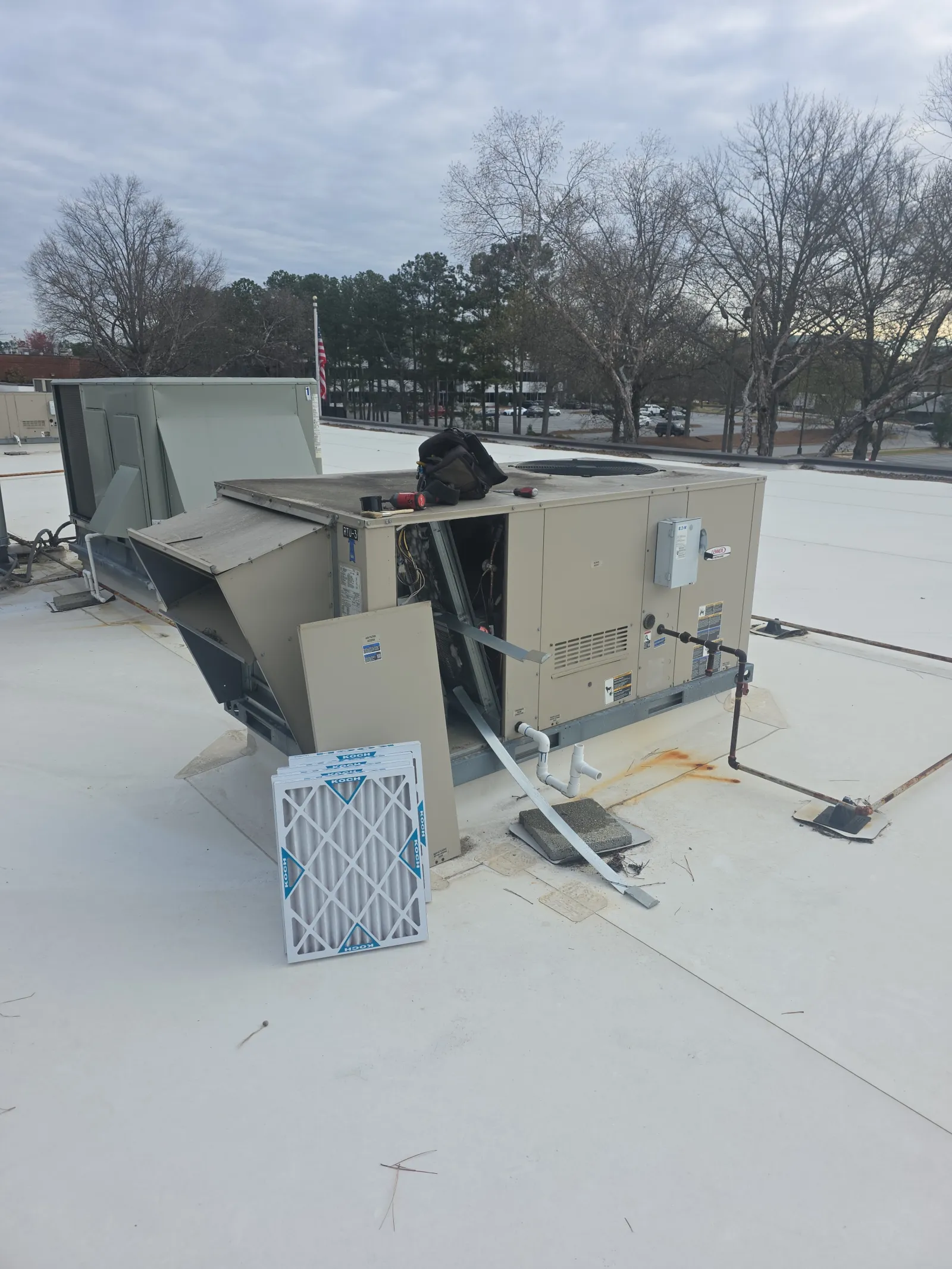 Commercial HVAC Repair and Maintenance on an RTU by The Air Company of GA.