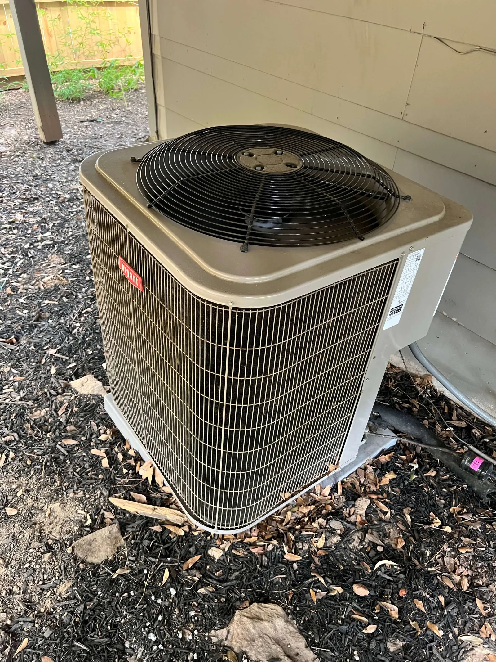 Outdoor Bryant heating unit repair by The Air Company of GA