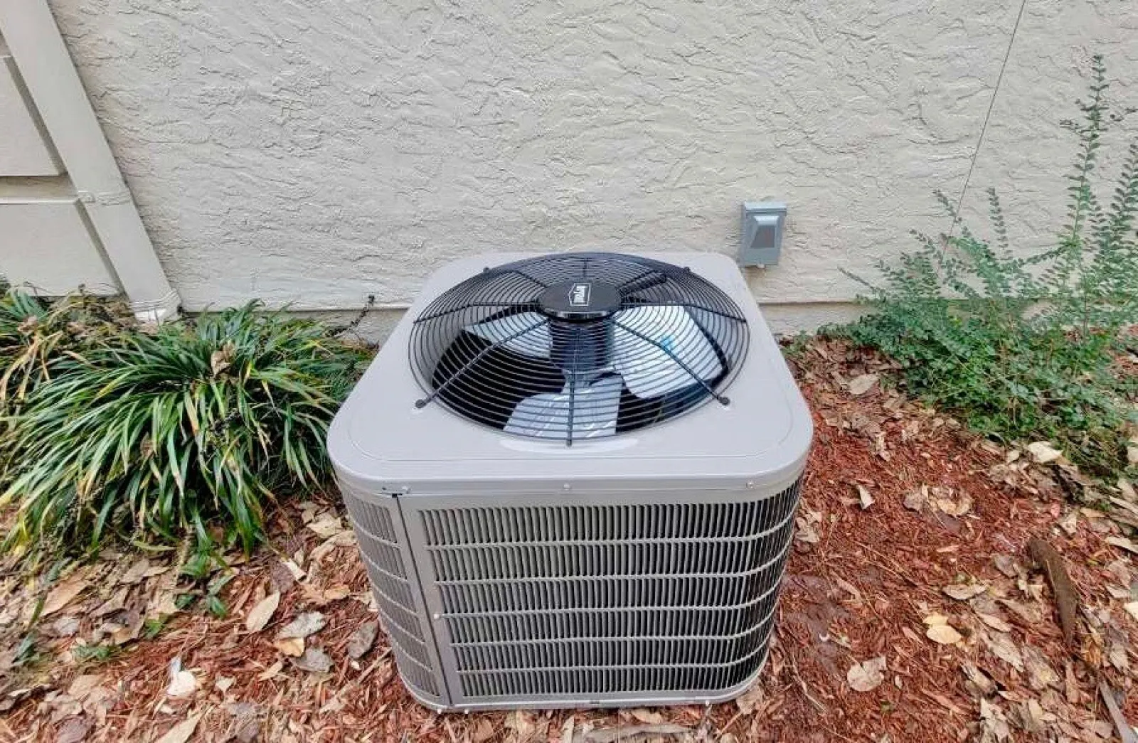 a white and black radiator outside