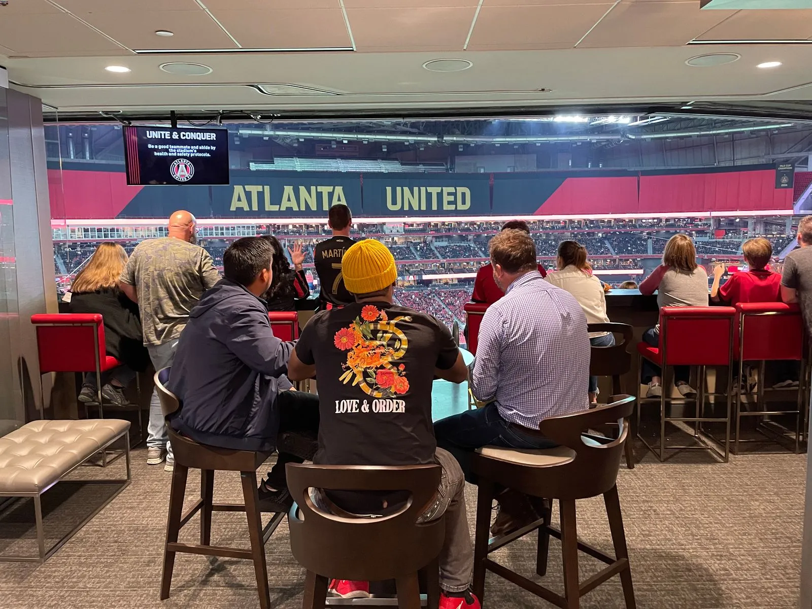 a group of people sitting at a table in a restaurant