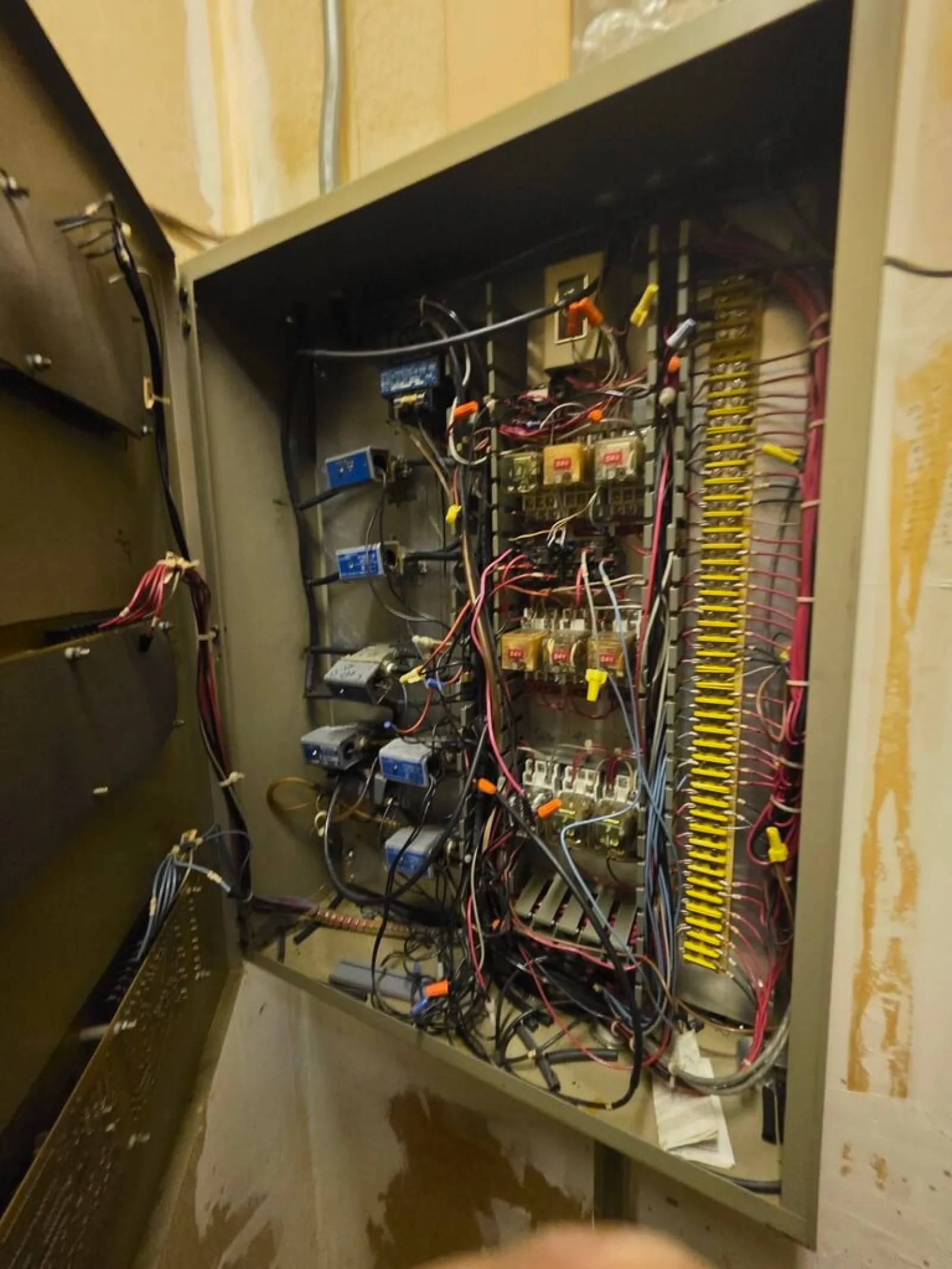 HVACV electrical panel with complex wiring, relays, and circuit components in Chamblee 30341 repaired by The Air Company of GA