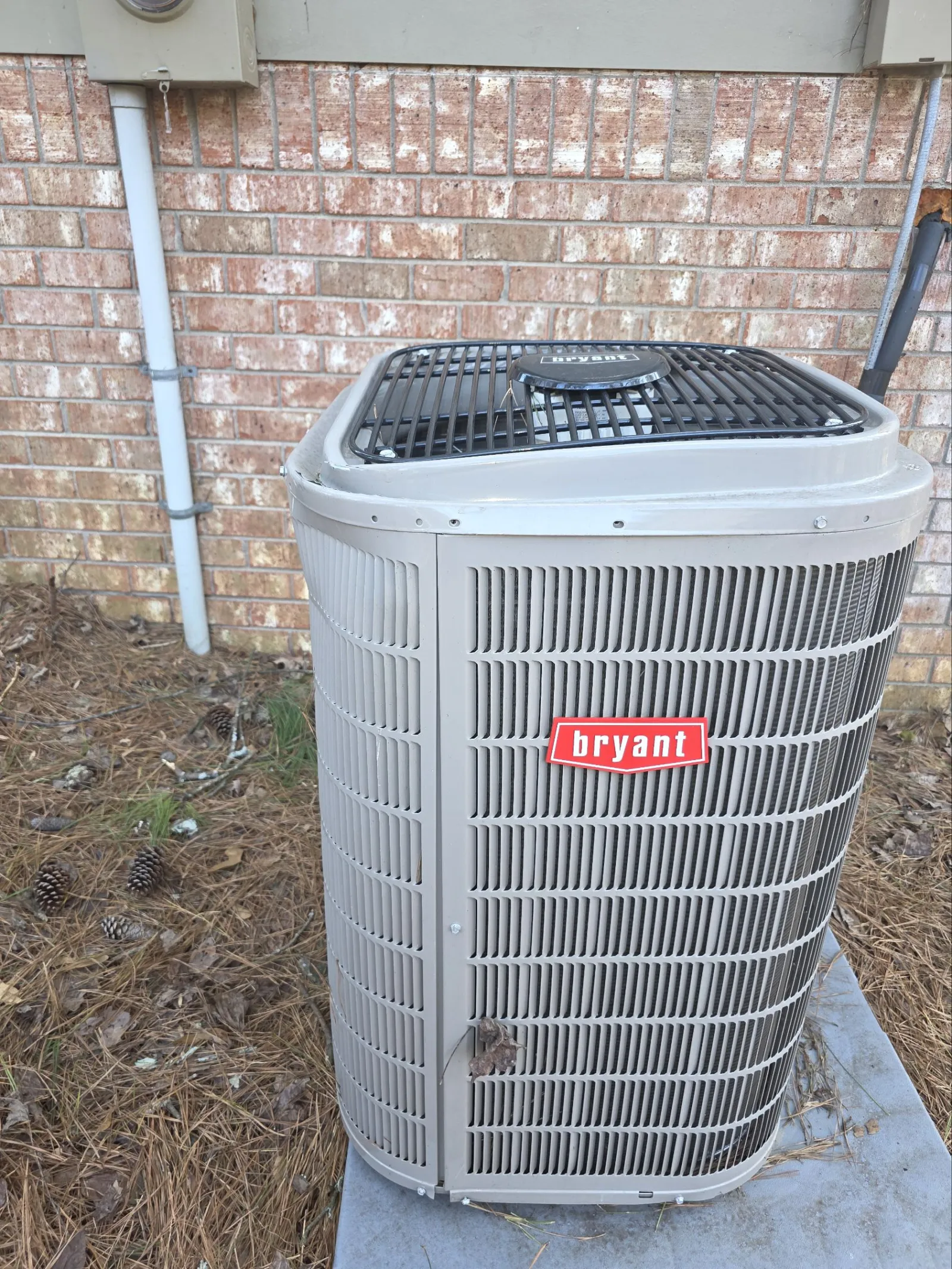 AC Repair in Marietta 30062 by The Air Company of GA.  Outdoor Bryant air conditioning unit damaged by fallen tree.