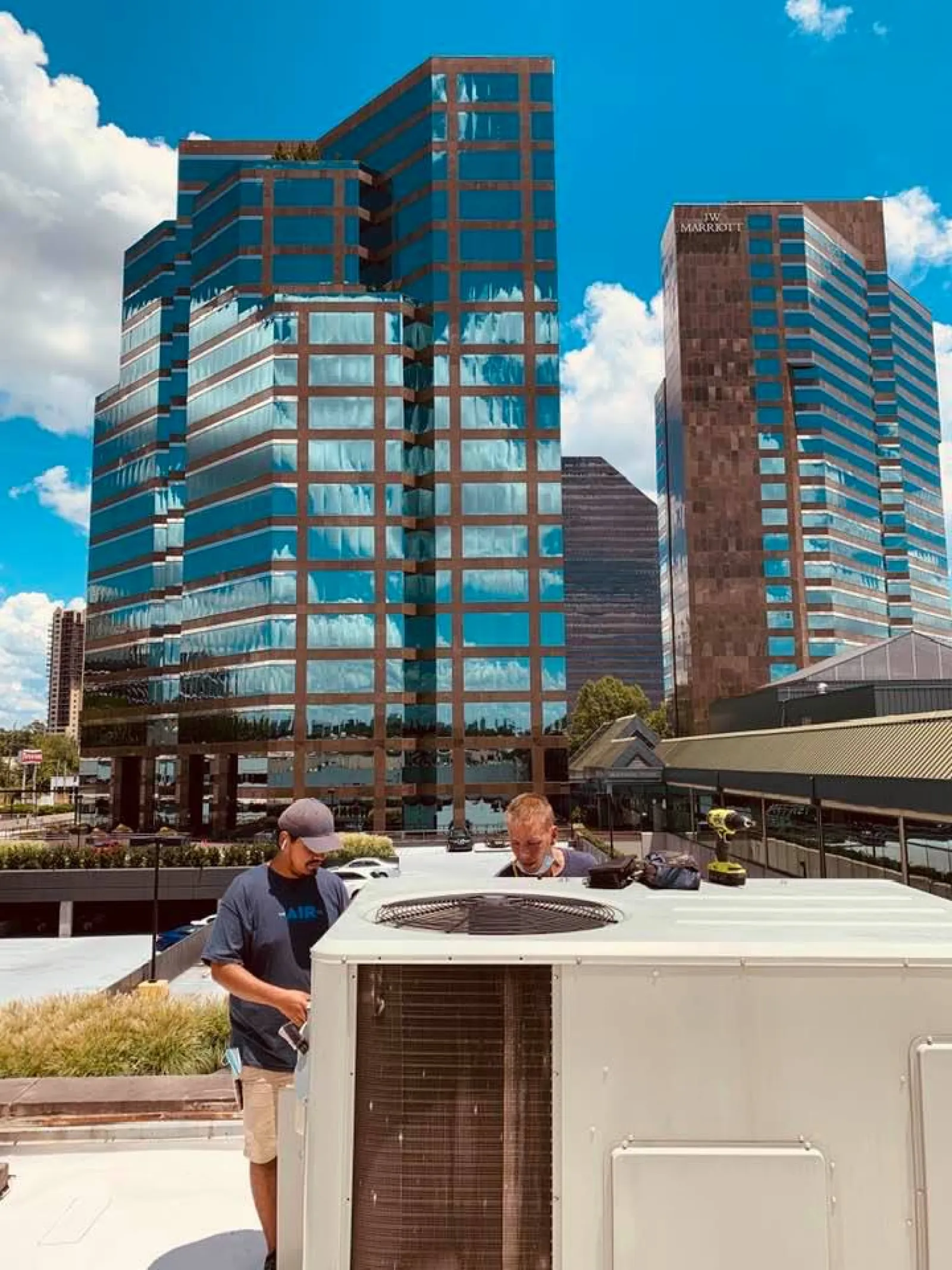 a man standing in front of a tall building