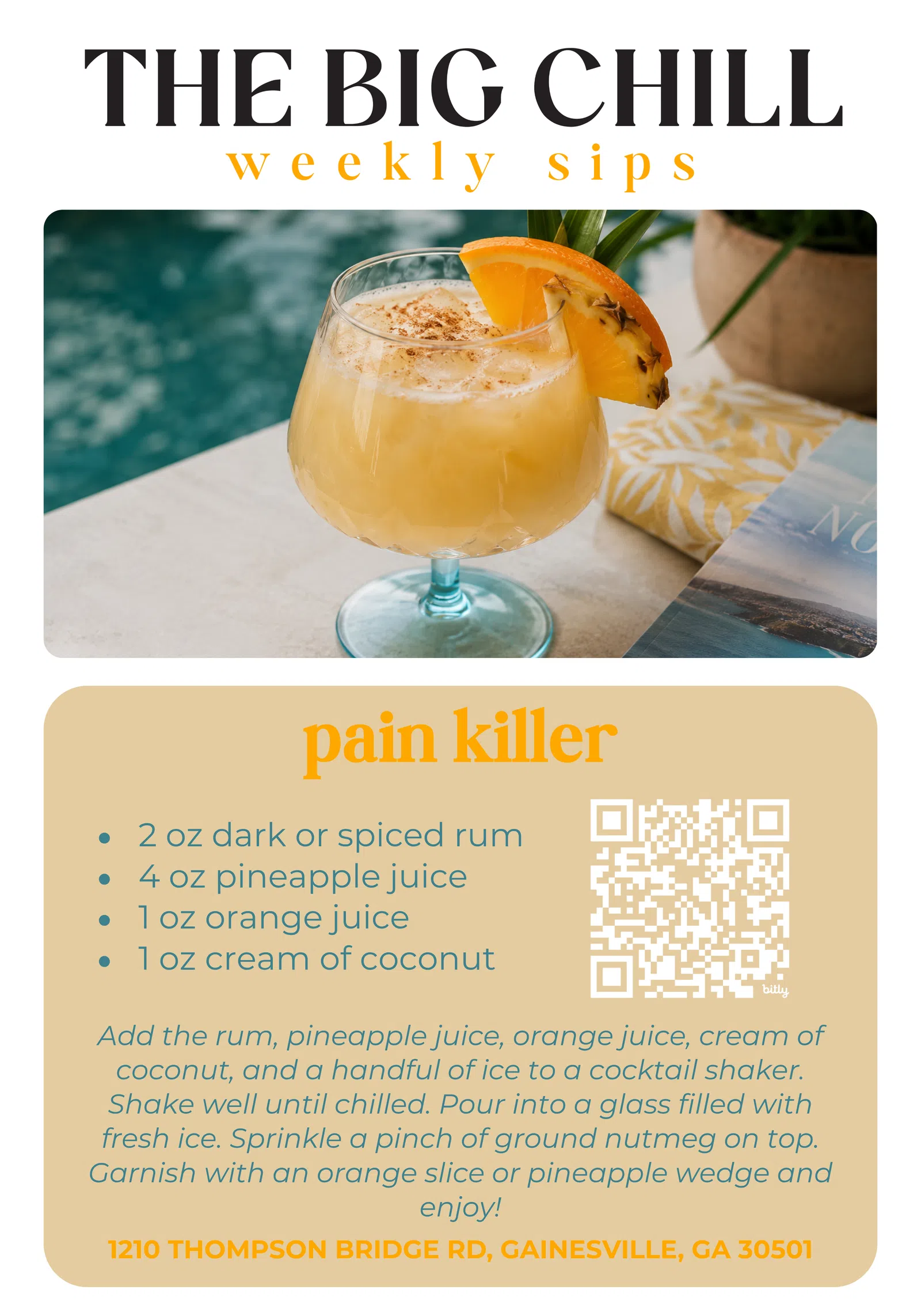 Pain Killer cocktail with pineapple wedge and orange slice garnish by a poolside setting with a book.
