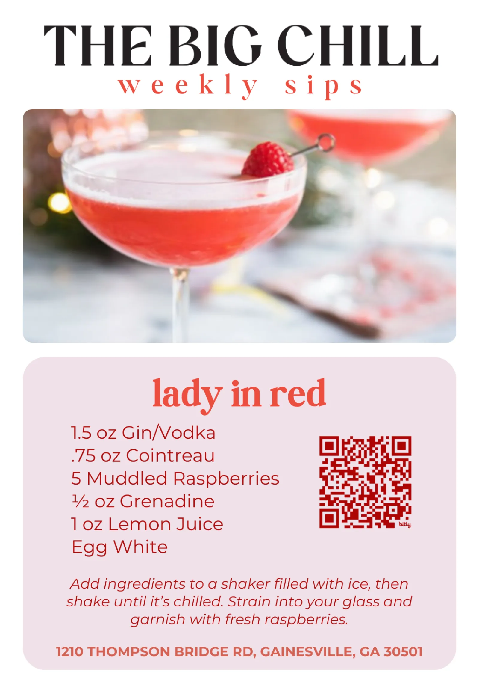 Cocktail glass filled with a pink Lady in Red drink garnished with a fresh raspberry on a pick.