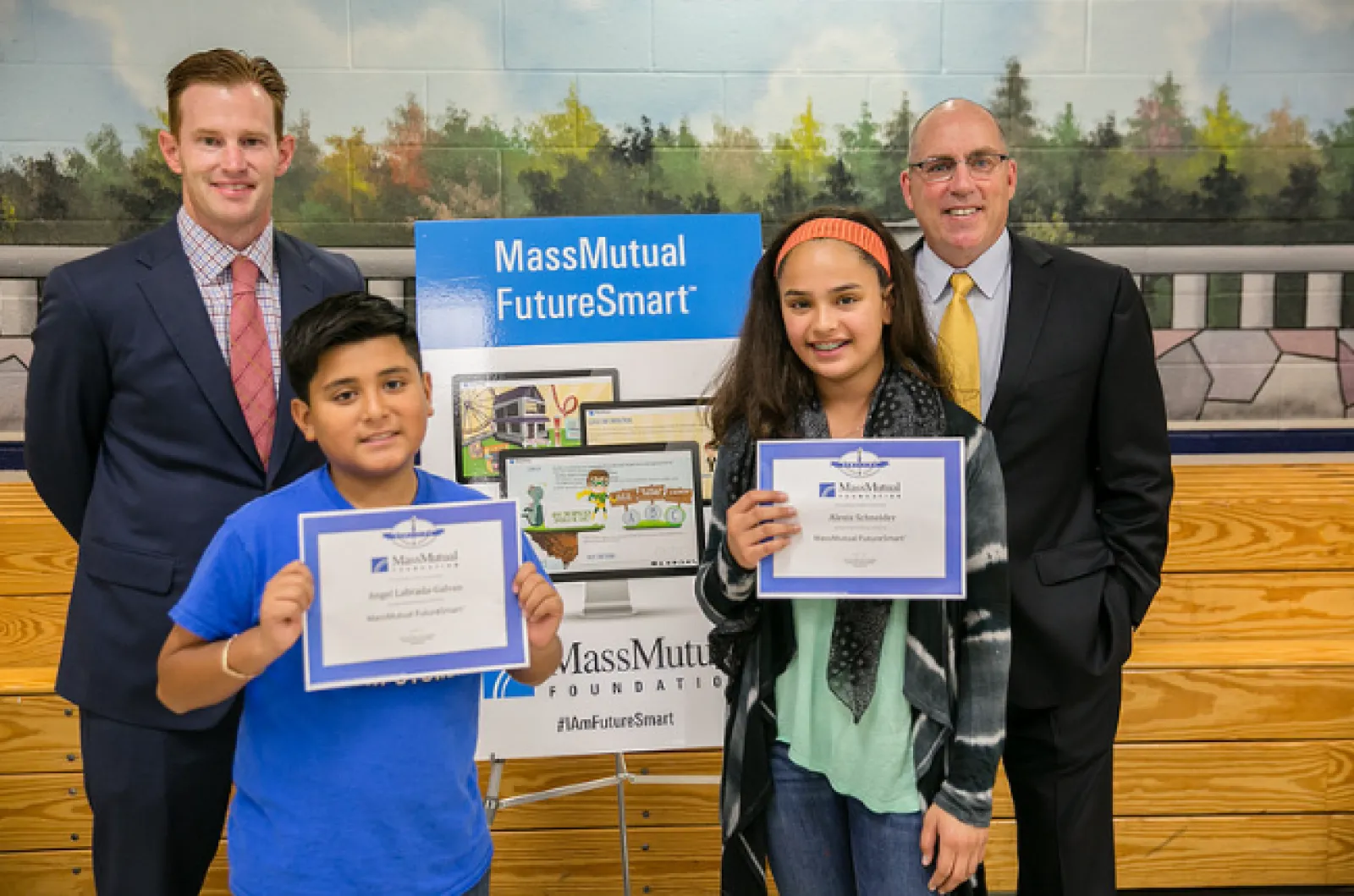 a group of people holding certificates