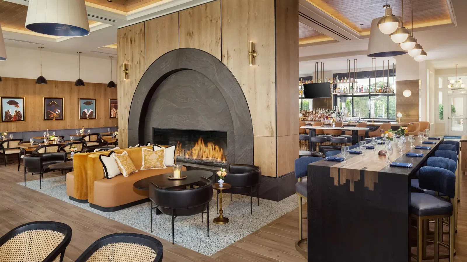 The Lowline by Hyatt JDV Custom Stained Wood Paneling and Stone Fireplace Surround