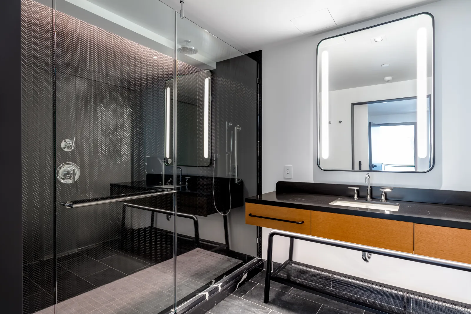 Homewood Suites & Canopy by Hilton Custom Shower Surround, Glass Door, Vanity Millwork, Quartz Countertop, and Quartz Threshold