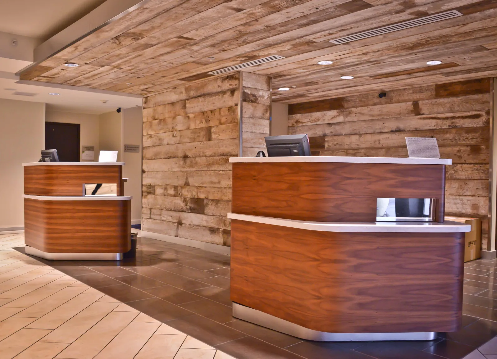 Loews & Courtyard Custom Reception Pod Millwork and Counters