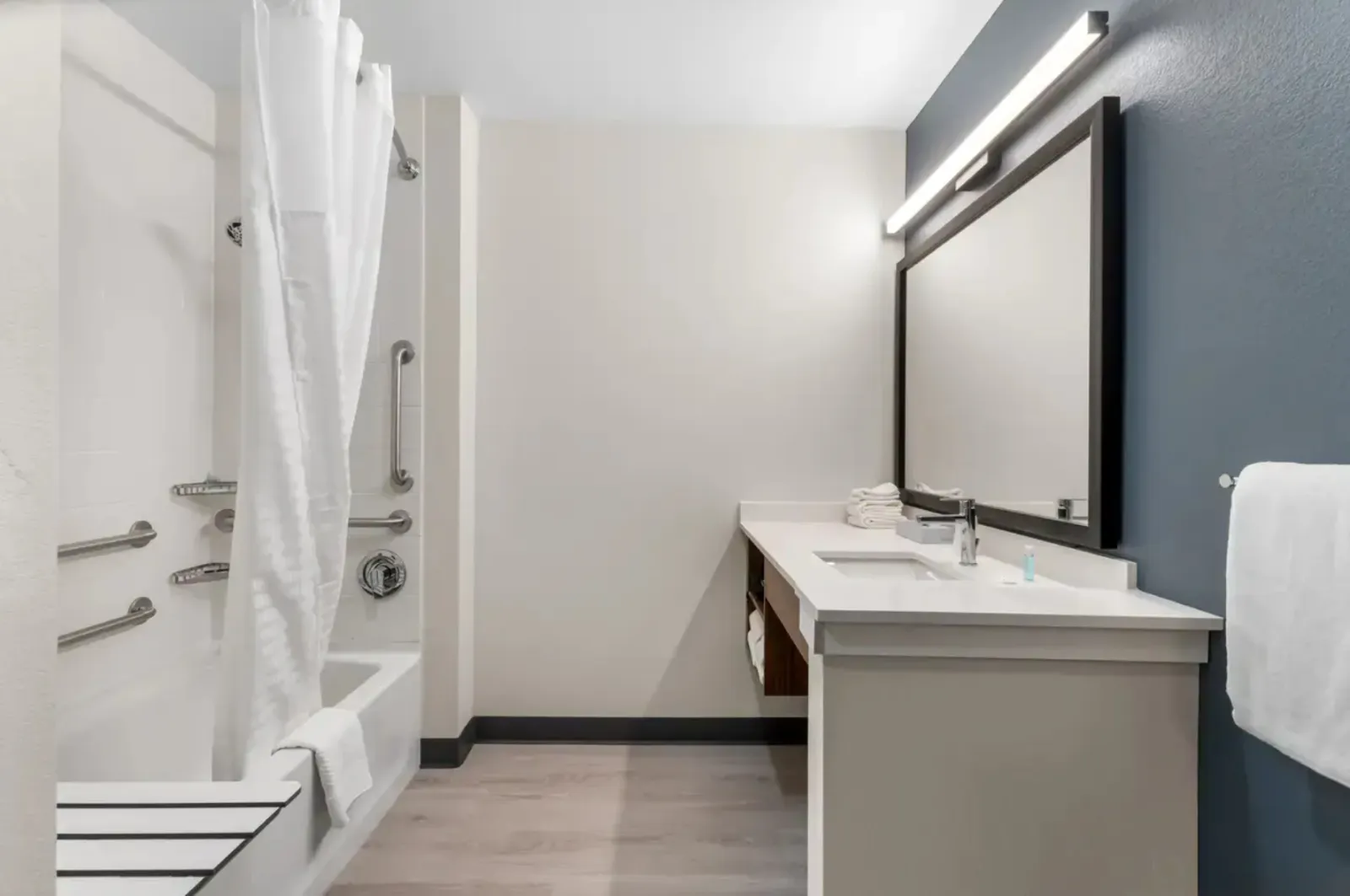 Everhome Suites Custom Guest Bath Vanity and Shower Surrounds