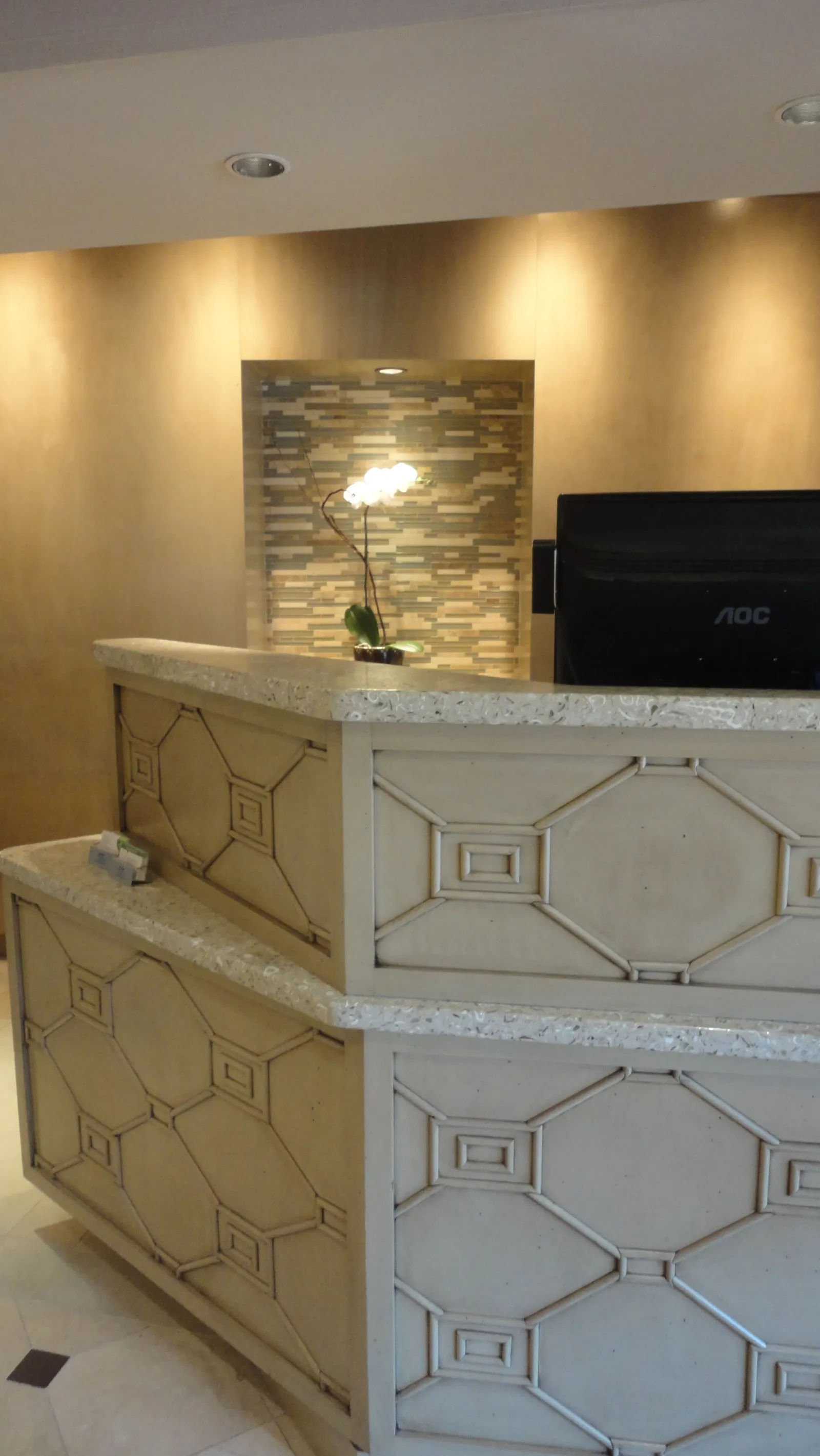 Courtyard Custom Front Desk Millwork and Granite Countertops