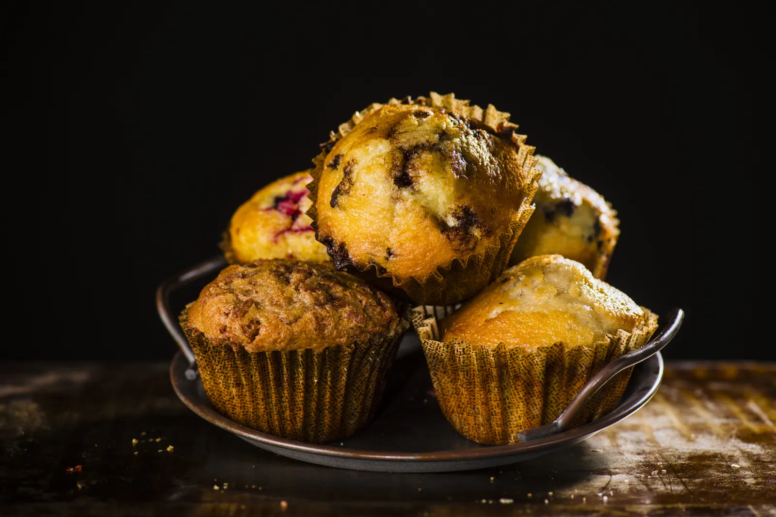 a bowl of muffins