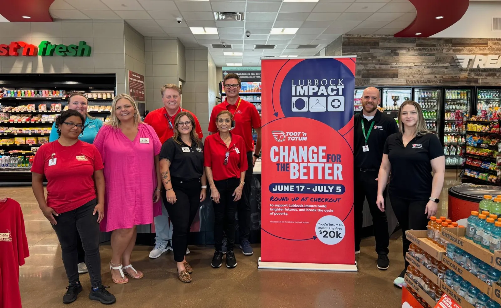 a group of people posing for a photo in a store