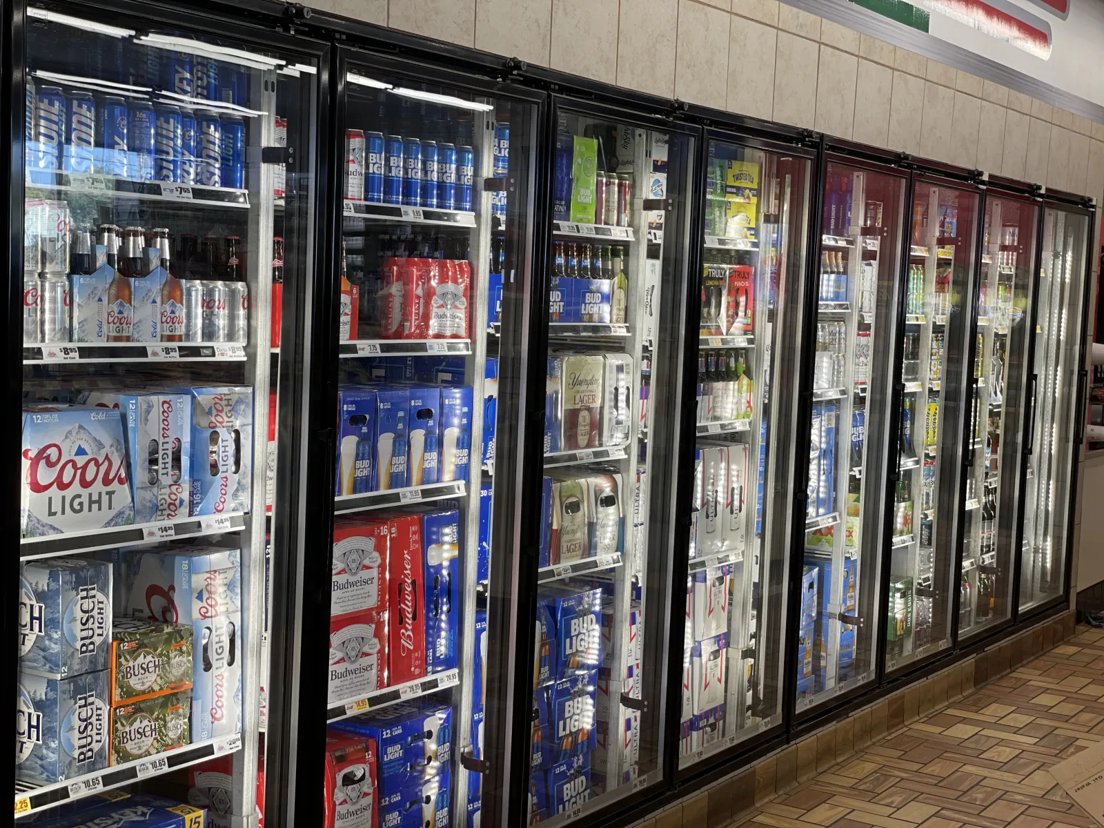 a store with many shelves of soda