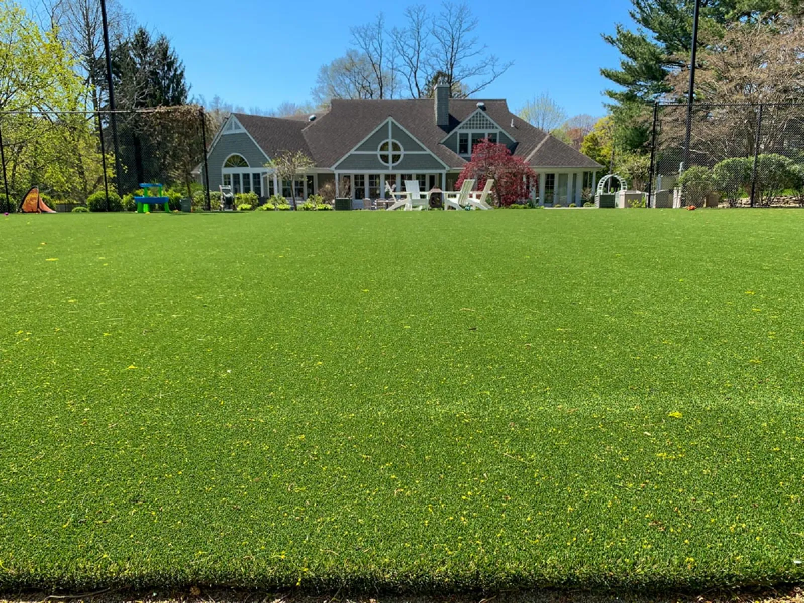 a large green lawn in front of a house