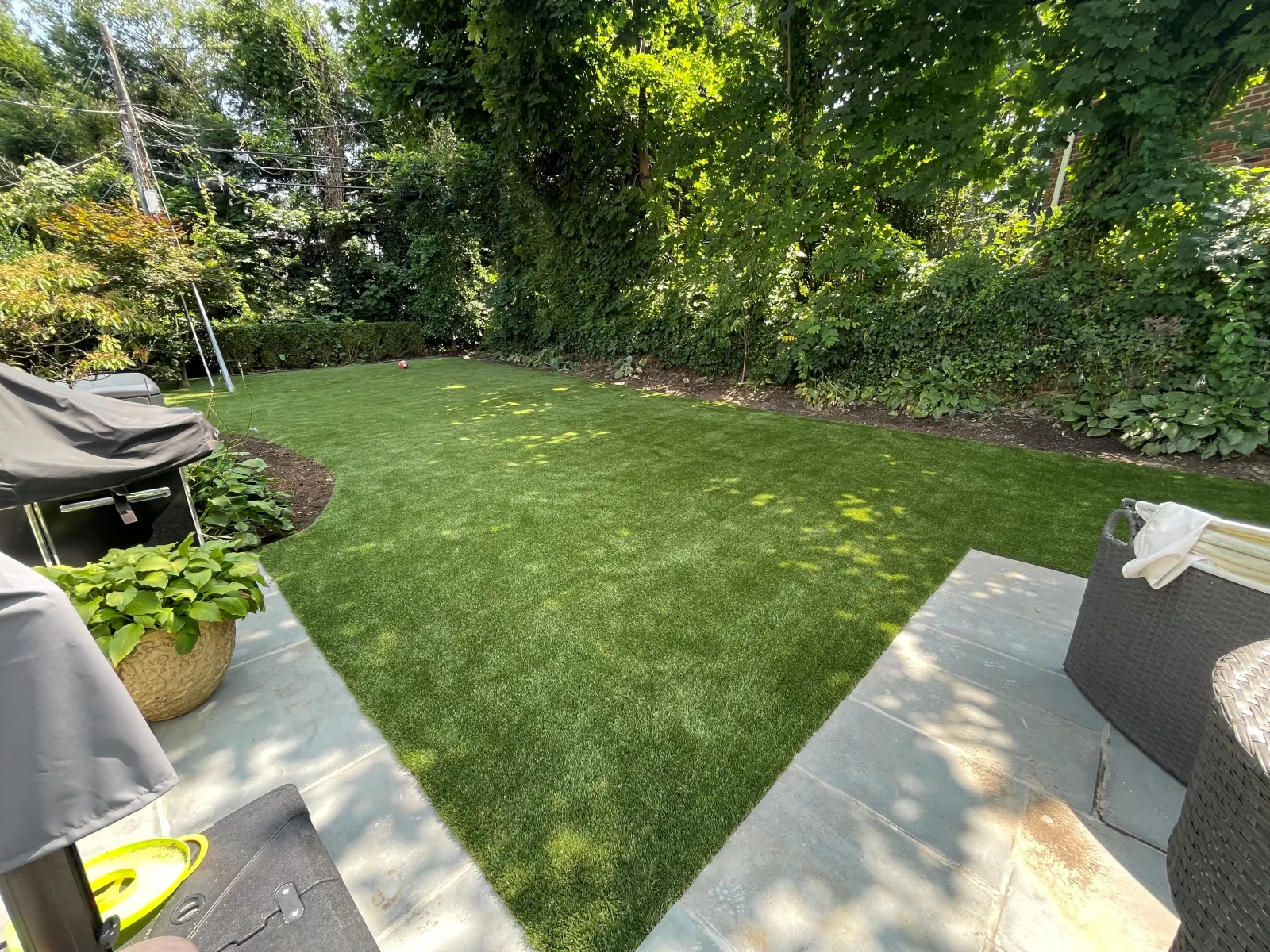 a backyard with a grass yard