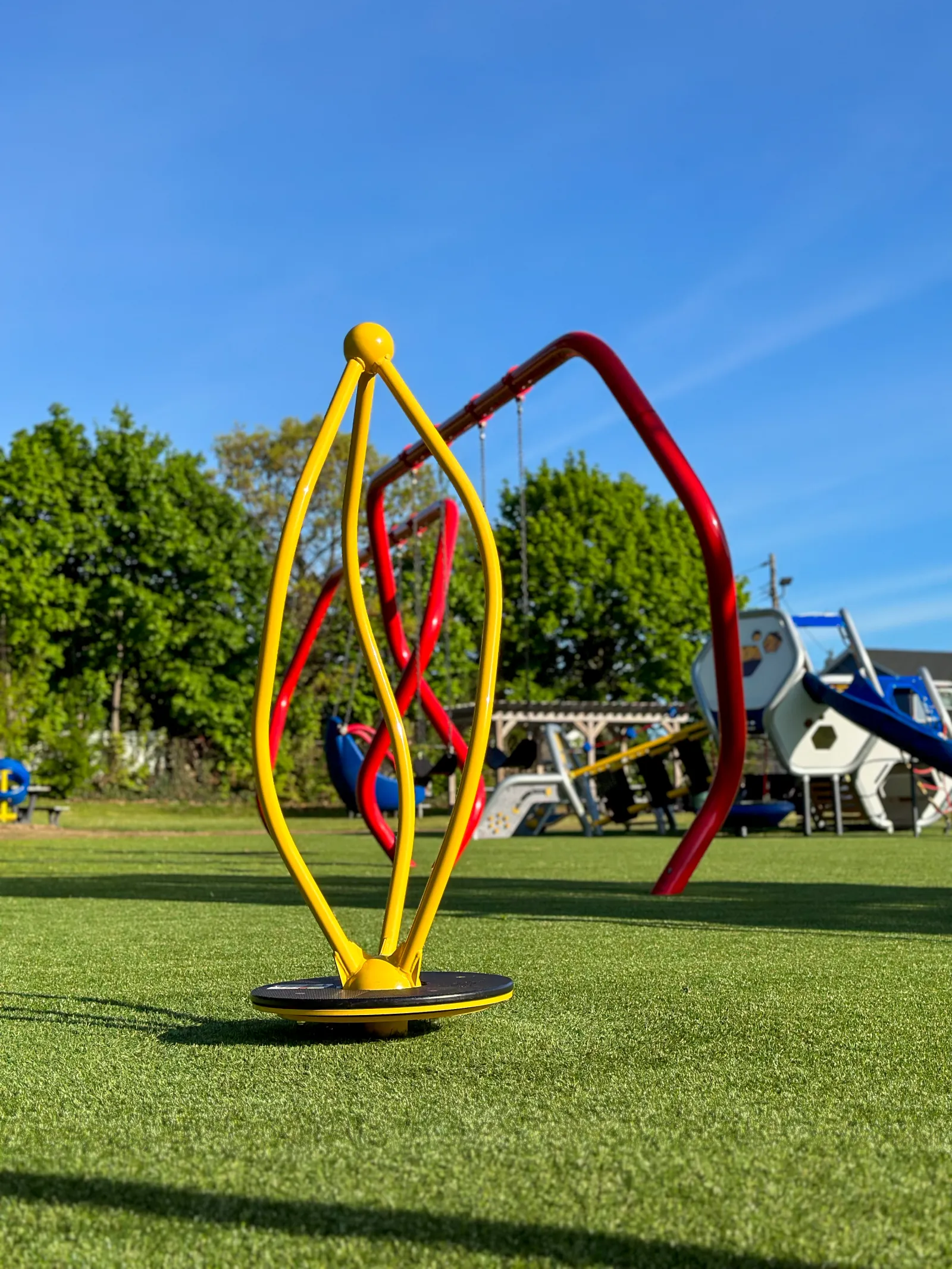 a colorful sculpture in a park