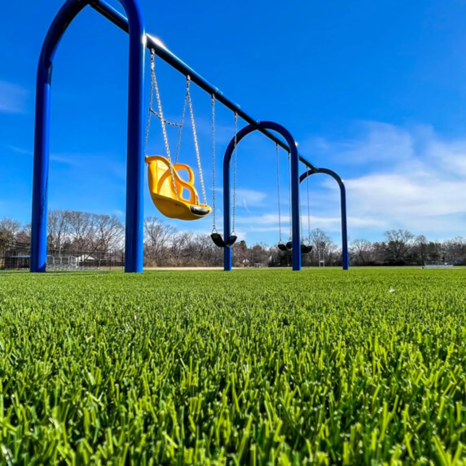a swing set in a field