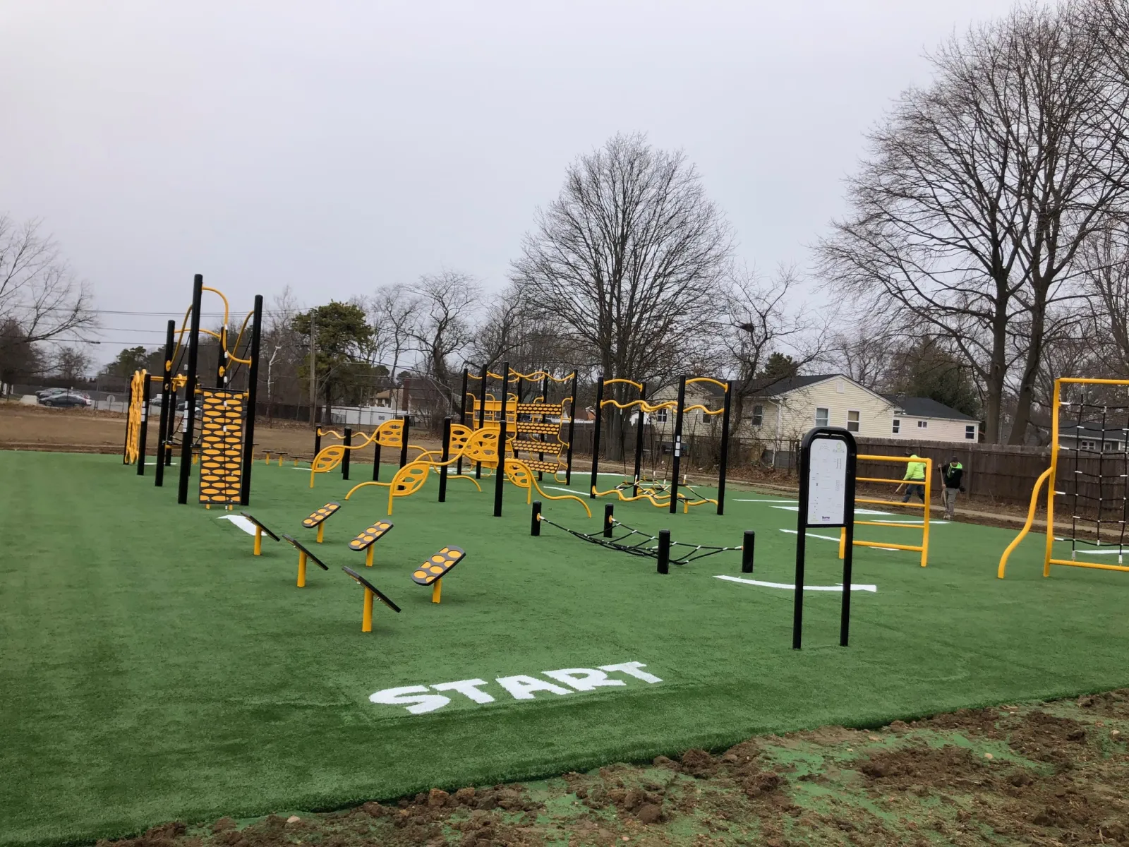 a playground with yellow and black bars