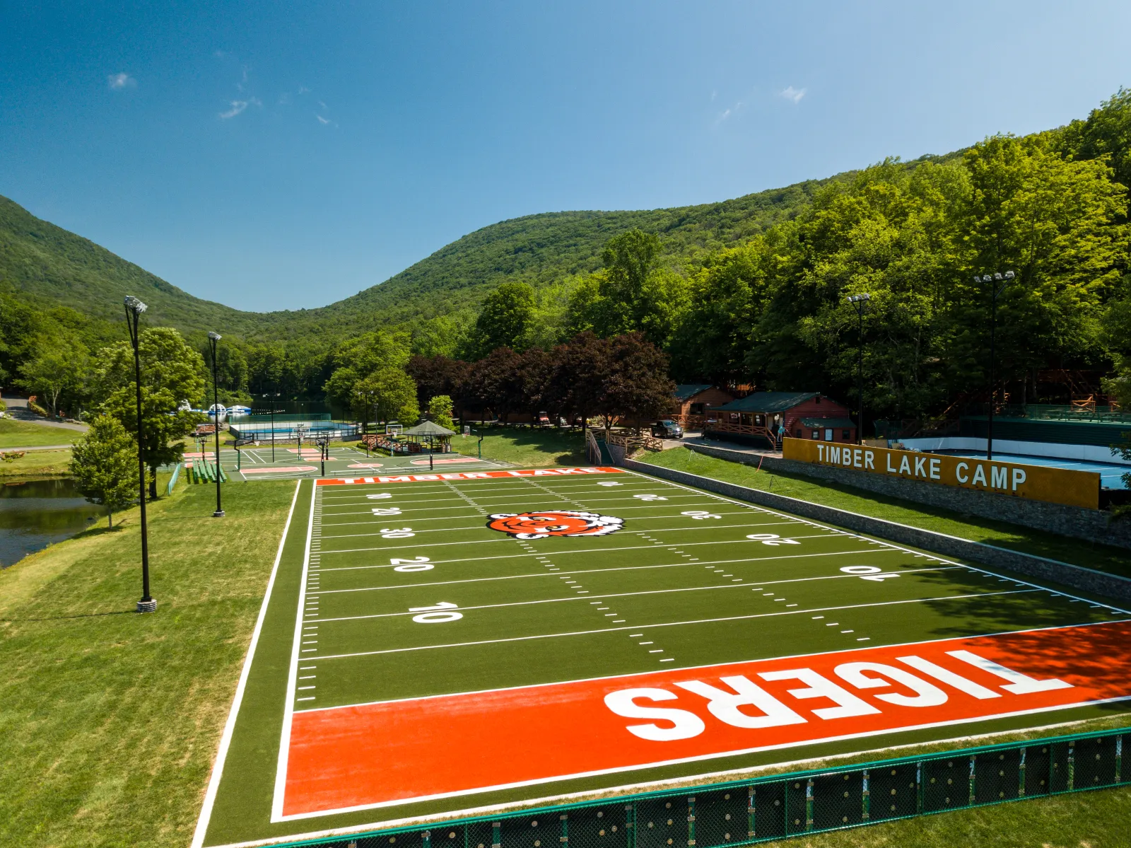 a football field with a red track