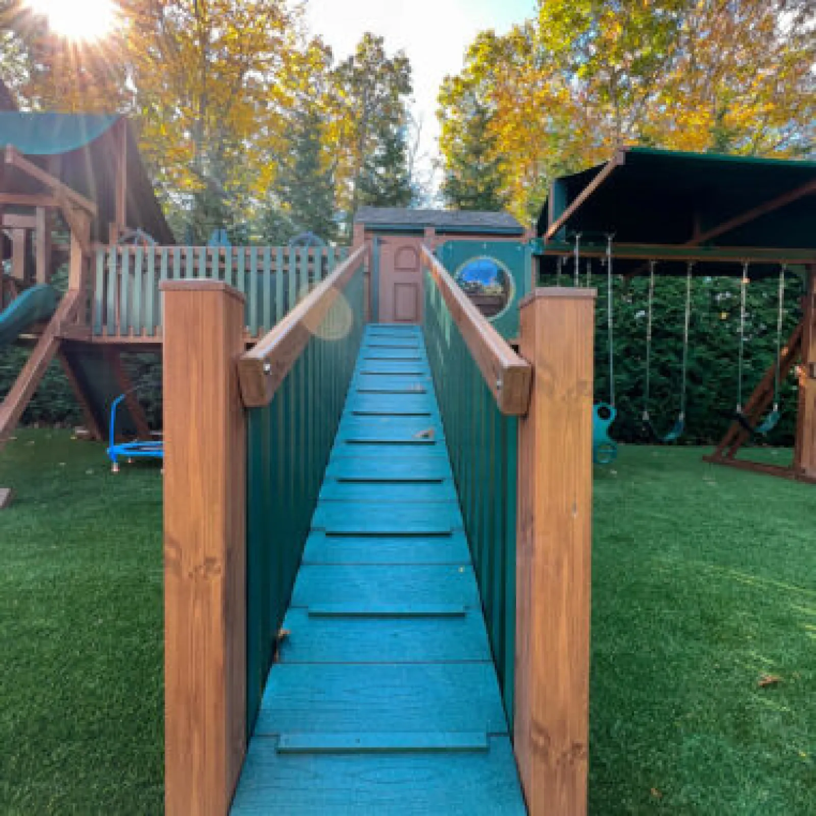 a wooden slide in a yard