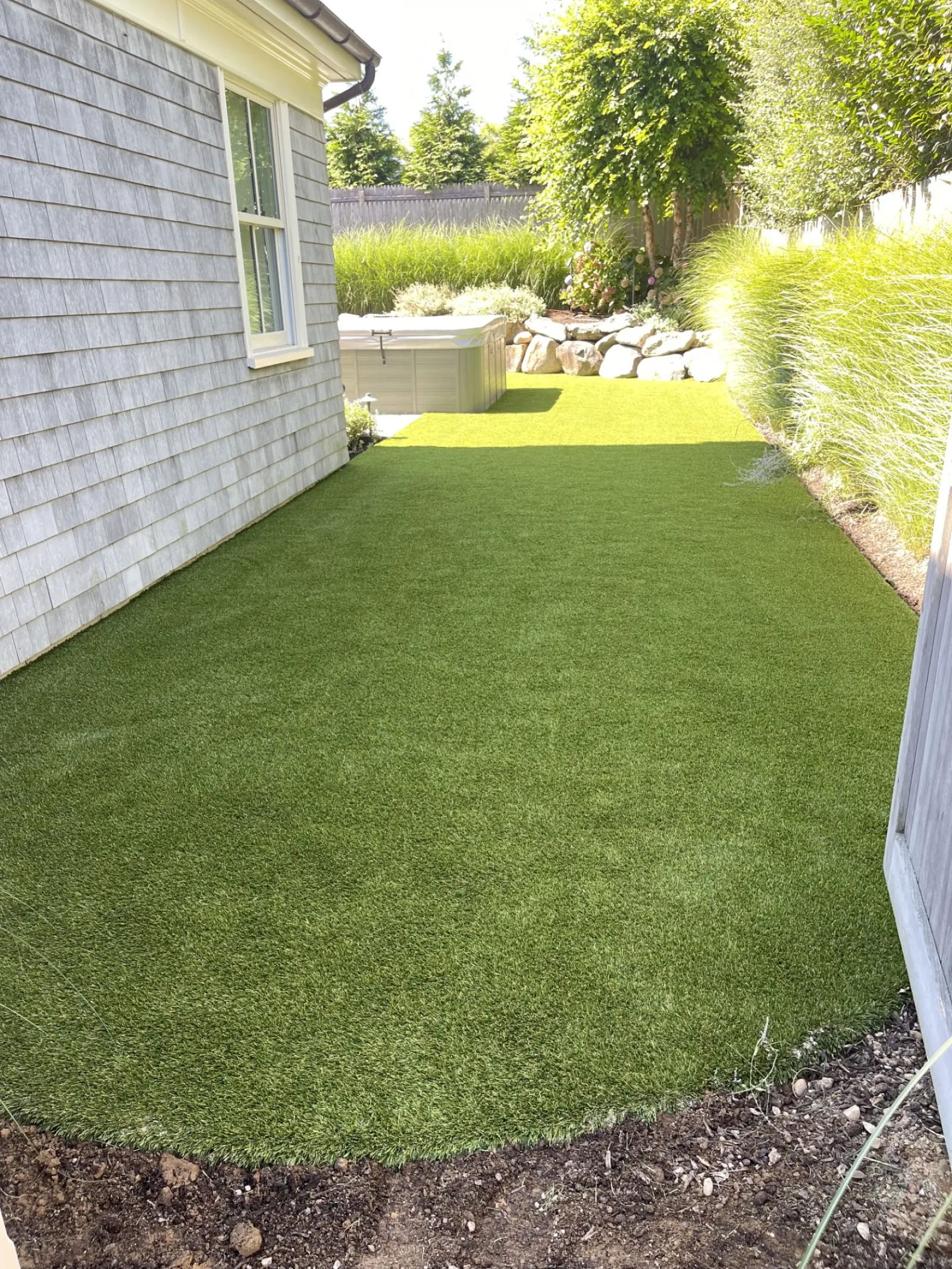 a backyard with a green lawn