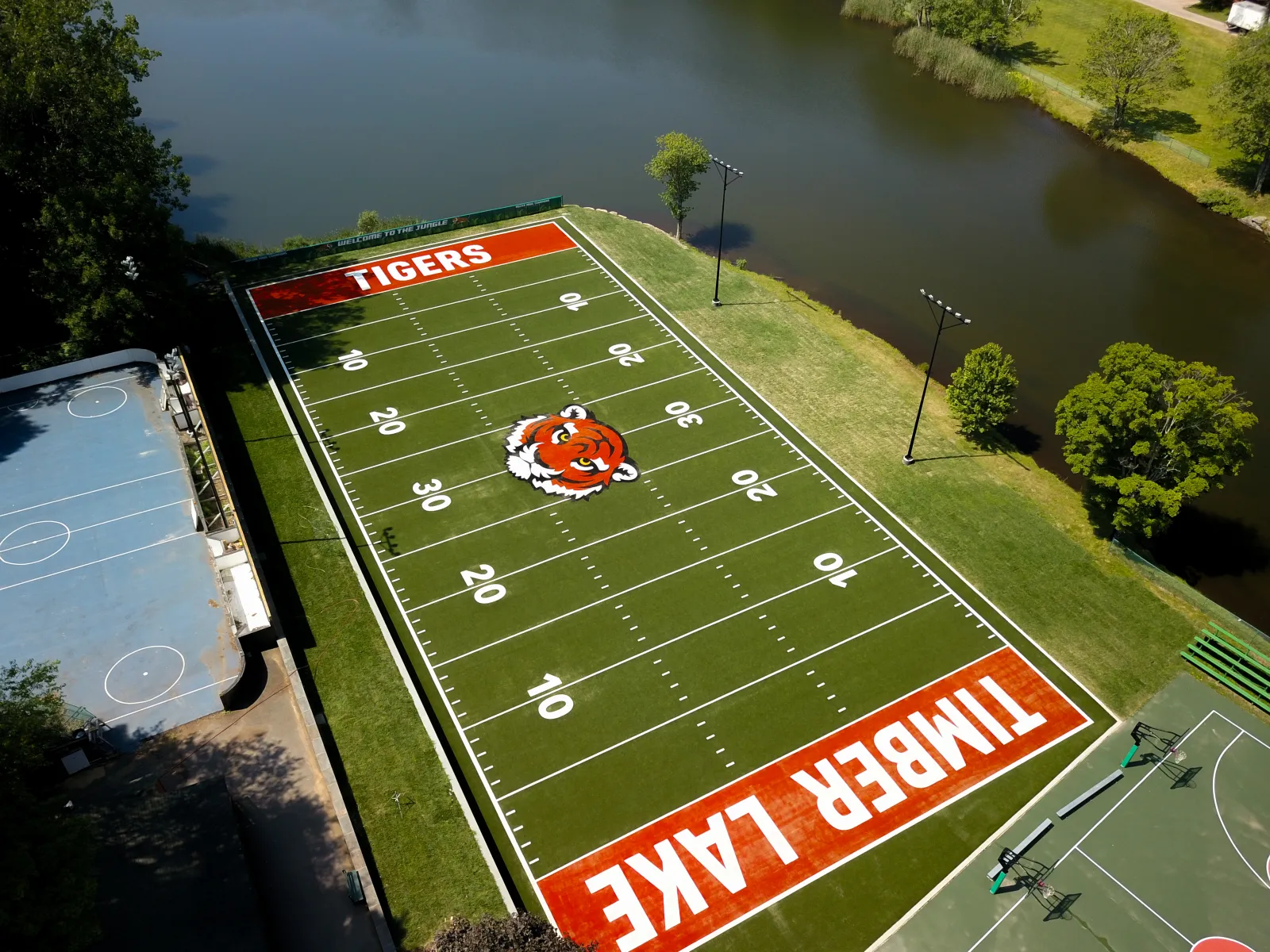 a football field with a red car