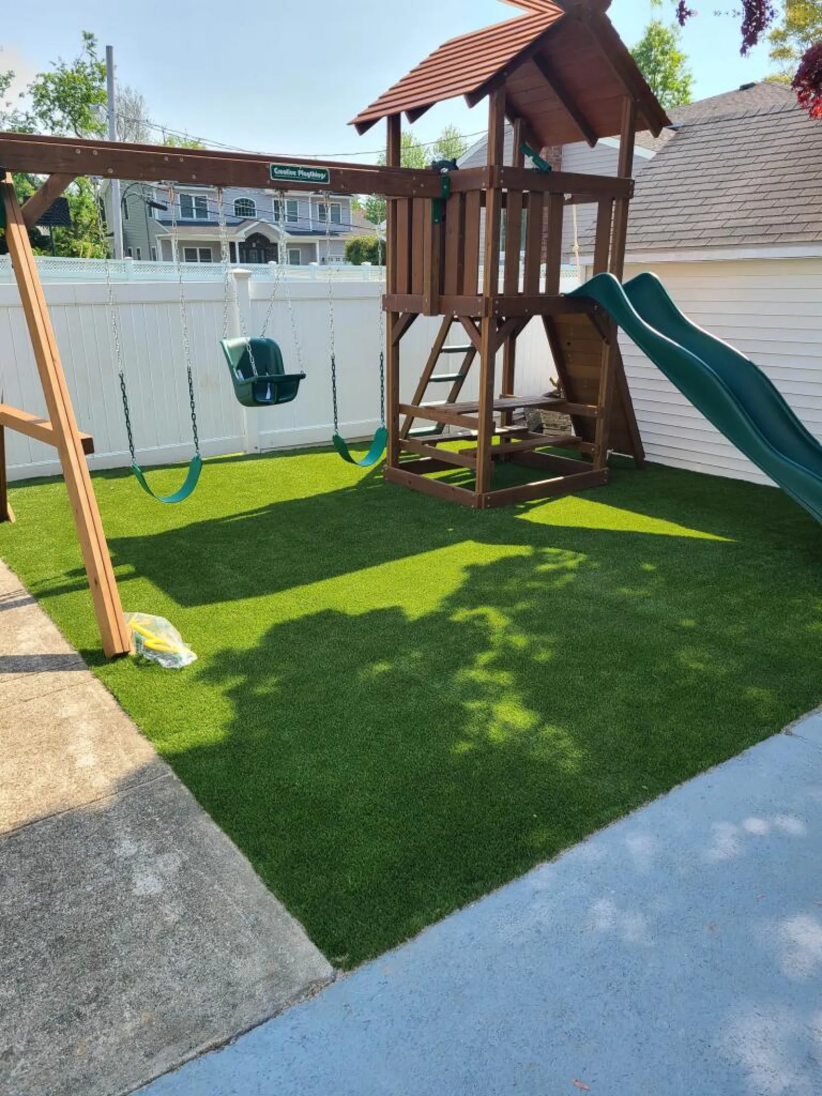 a backyard with a slide and a pool