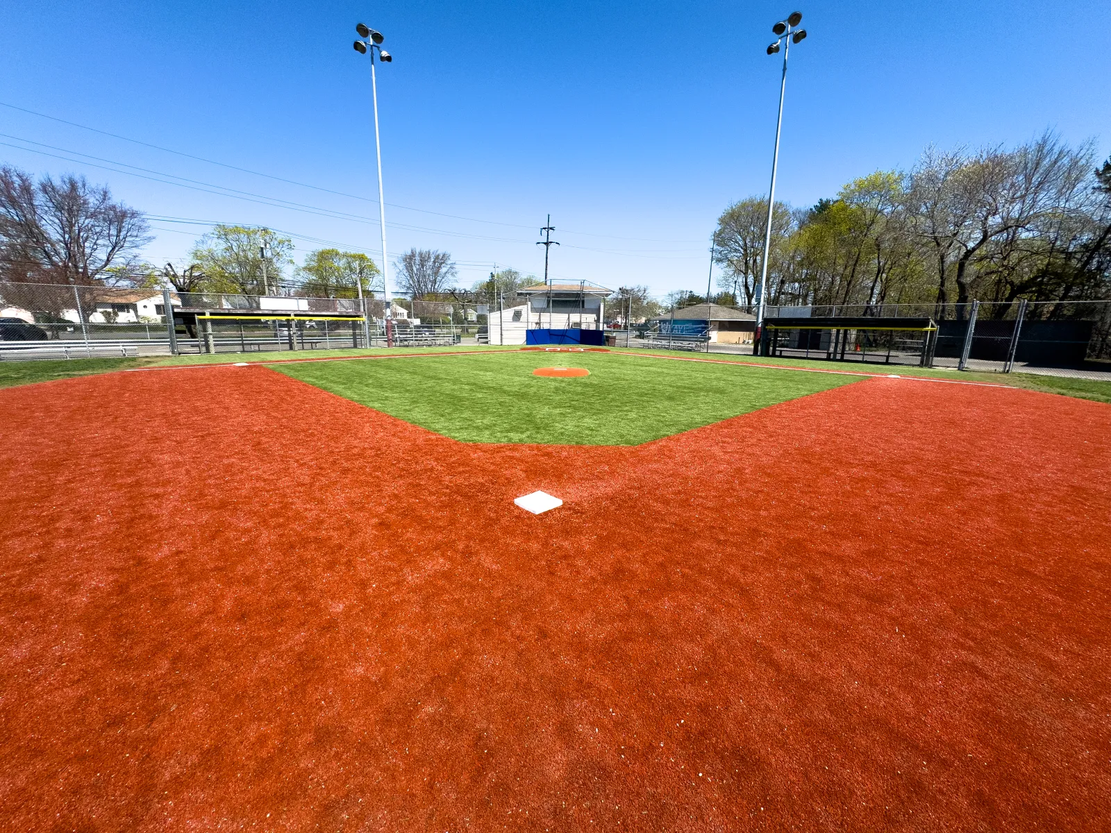 a field with a red dirt field