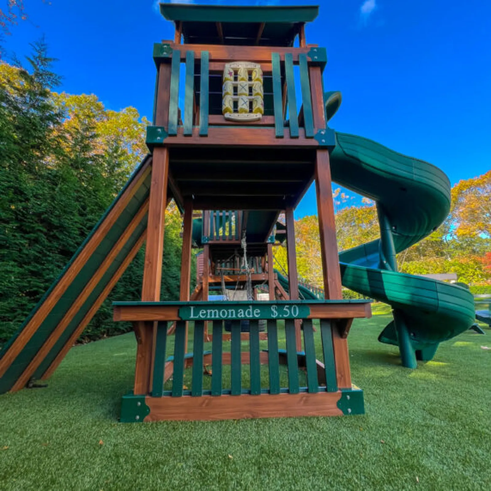 a small play structure in a grassy area