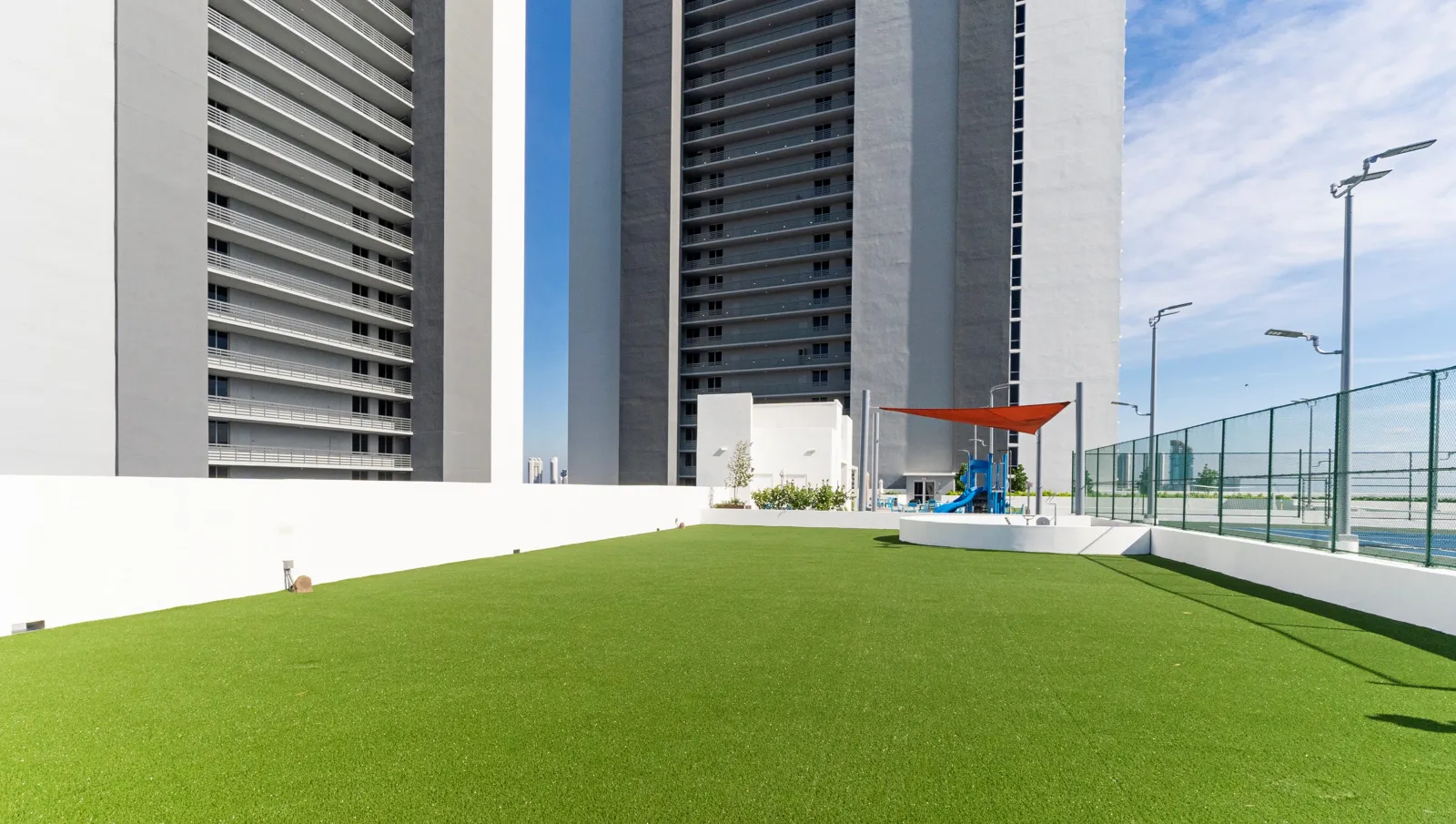 a green lawn in front of a building