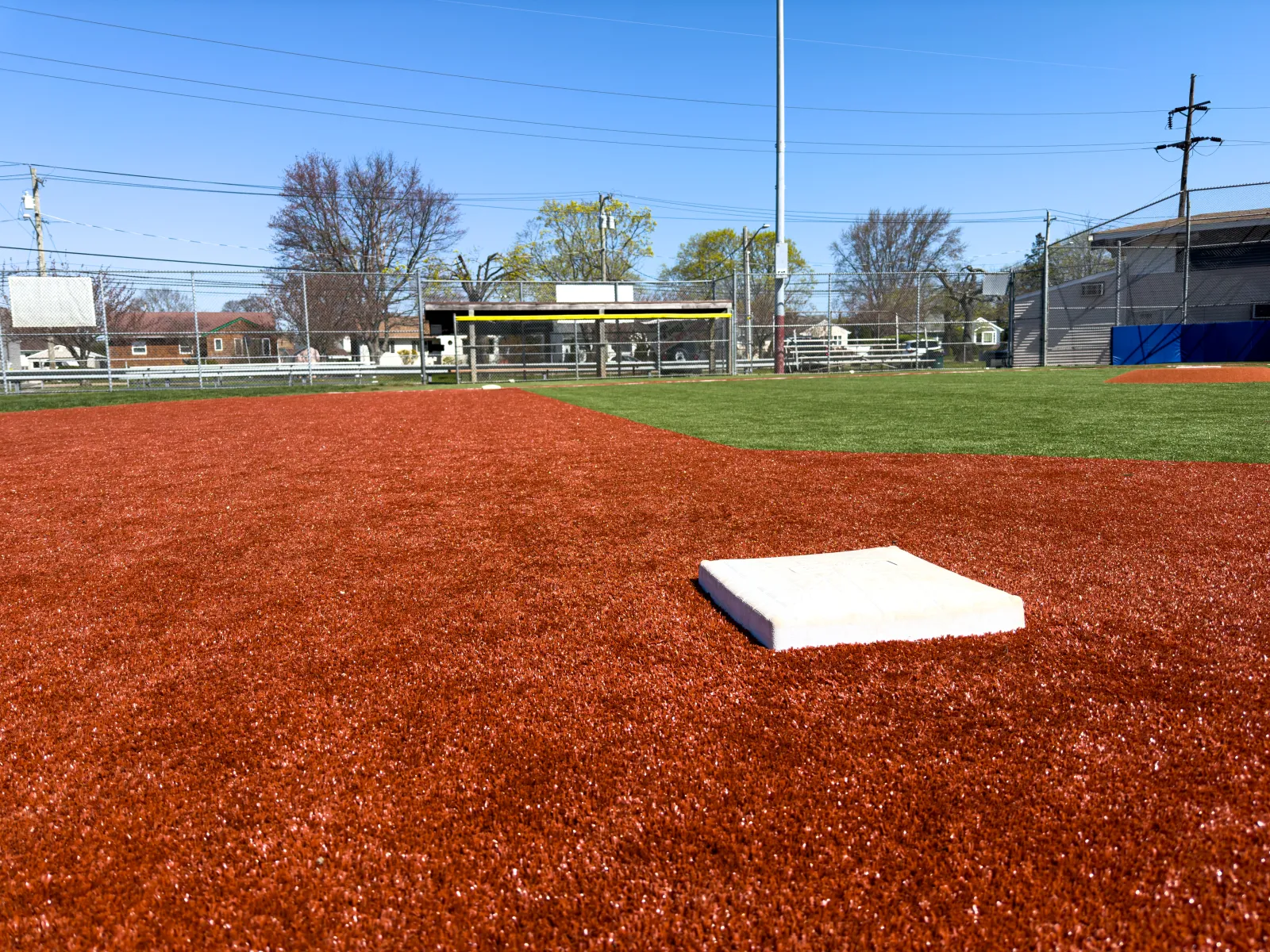 a baseball field with a white paper on the ground