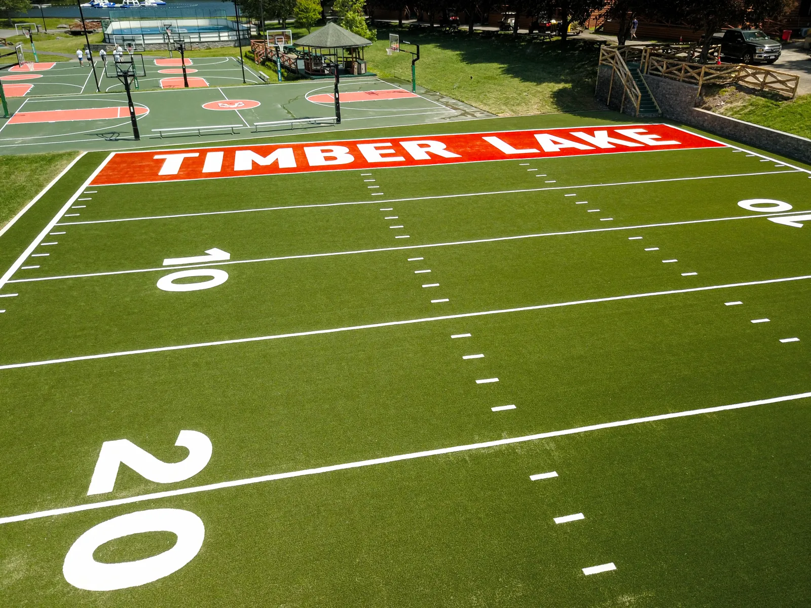 a football field with a crowd watching