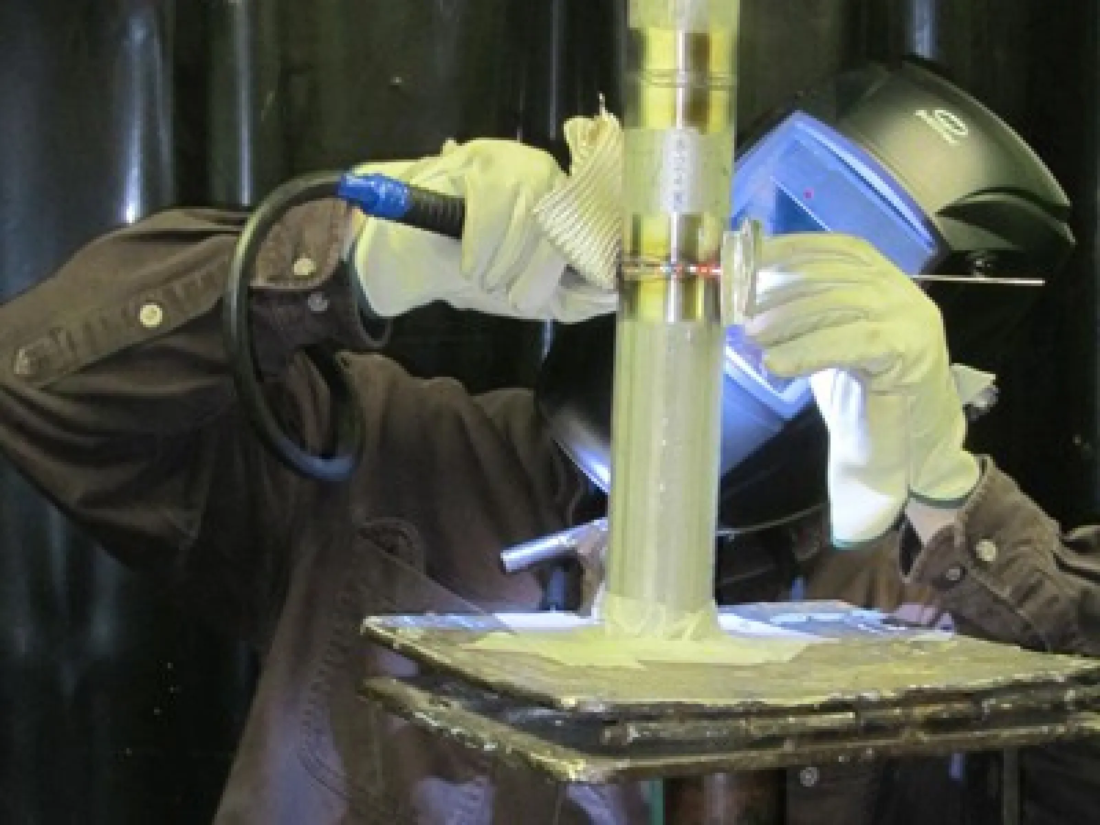 a person in a lab coat working on a machine