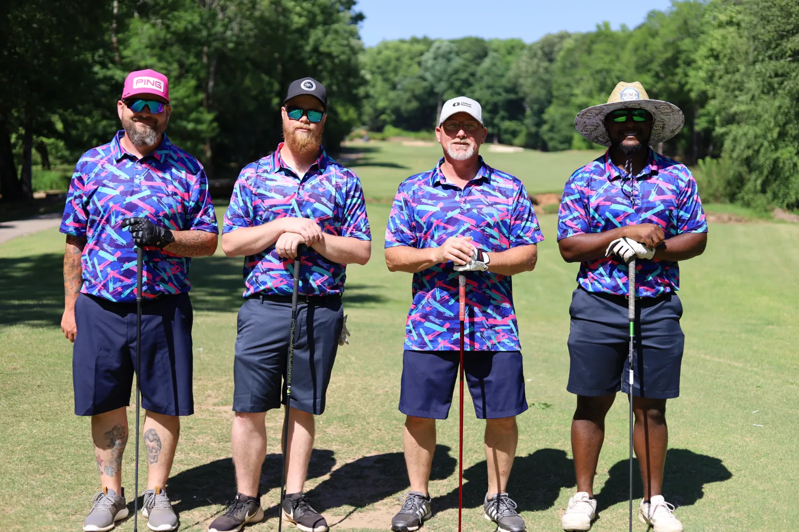 a group of men wearing golf gear