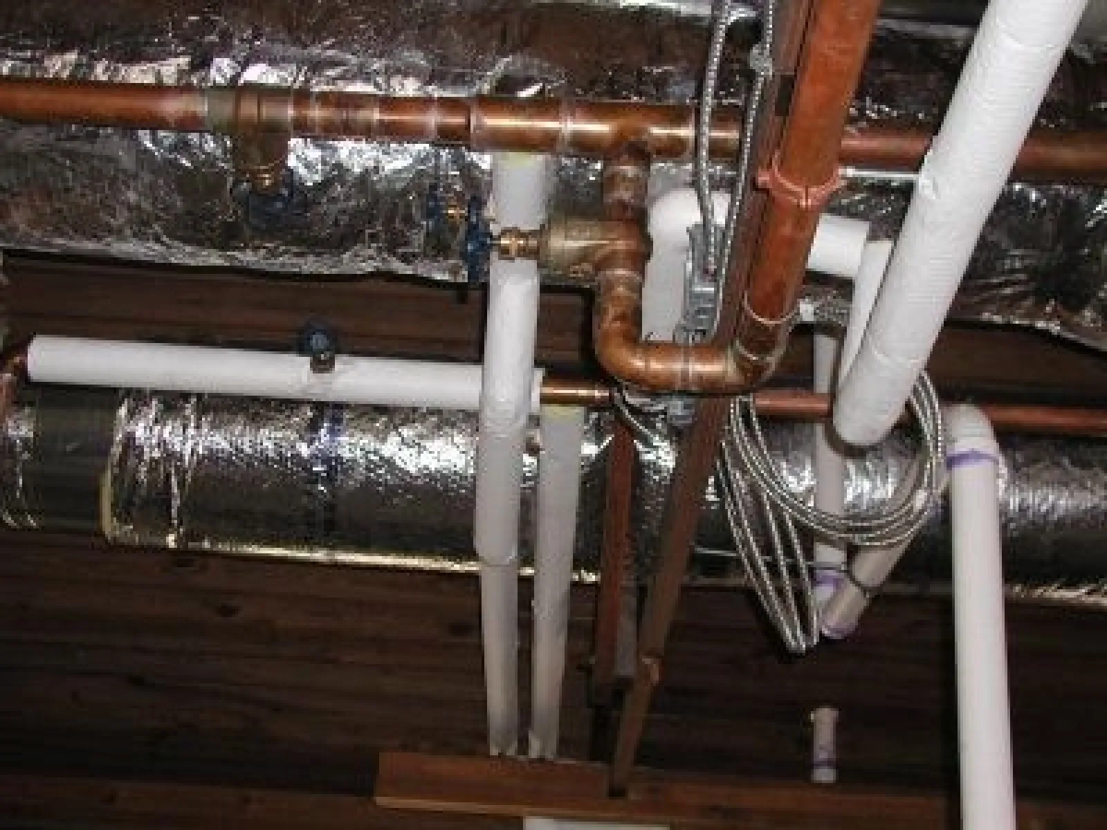 a wooden structure with pipes
