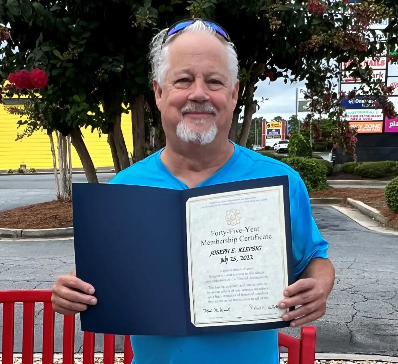 a person holding a certificate
