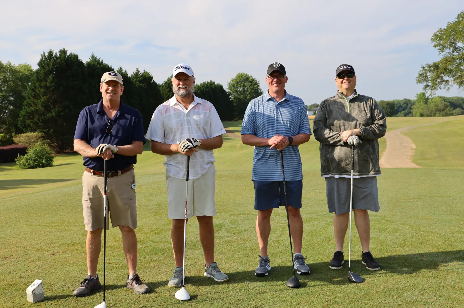 a group of men on a golf course