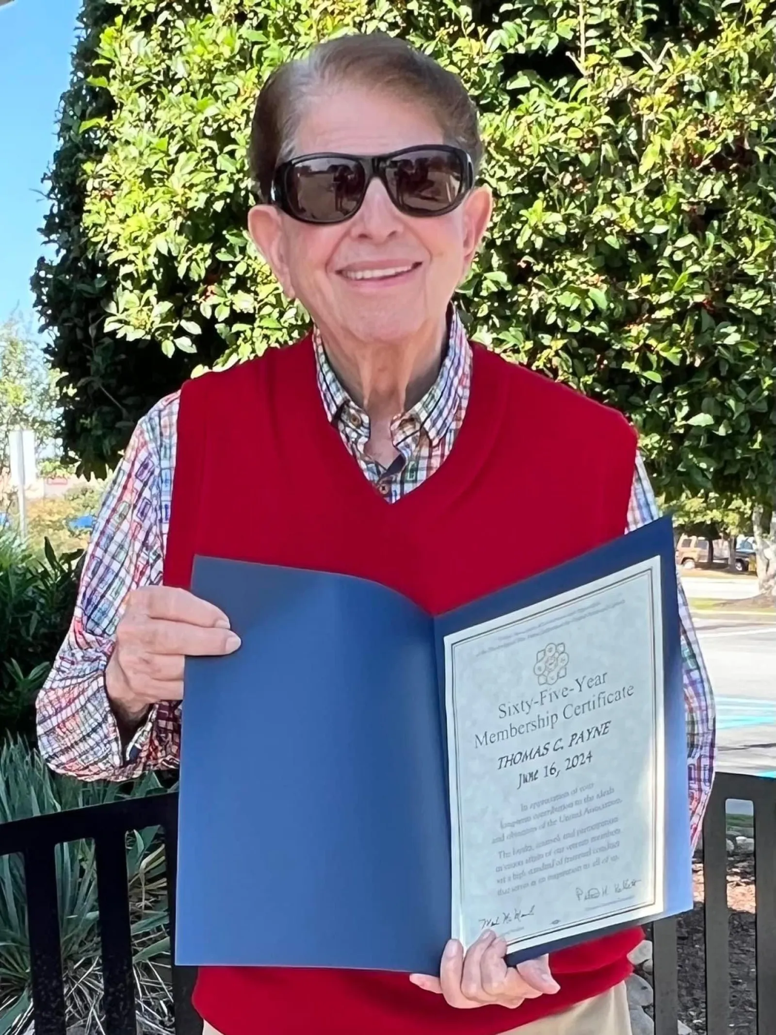 a person holding a certificate