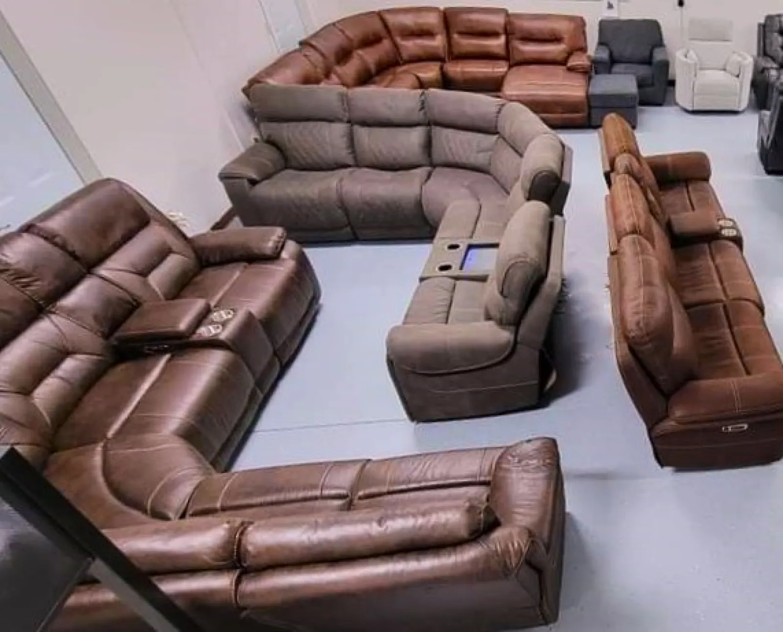 a group of brown leather chairs