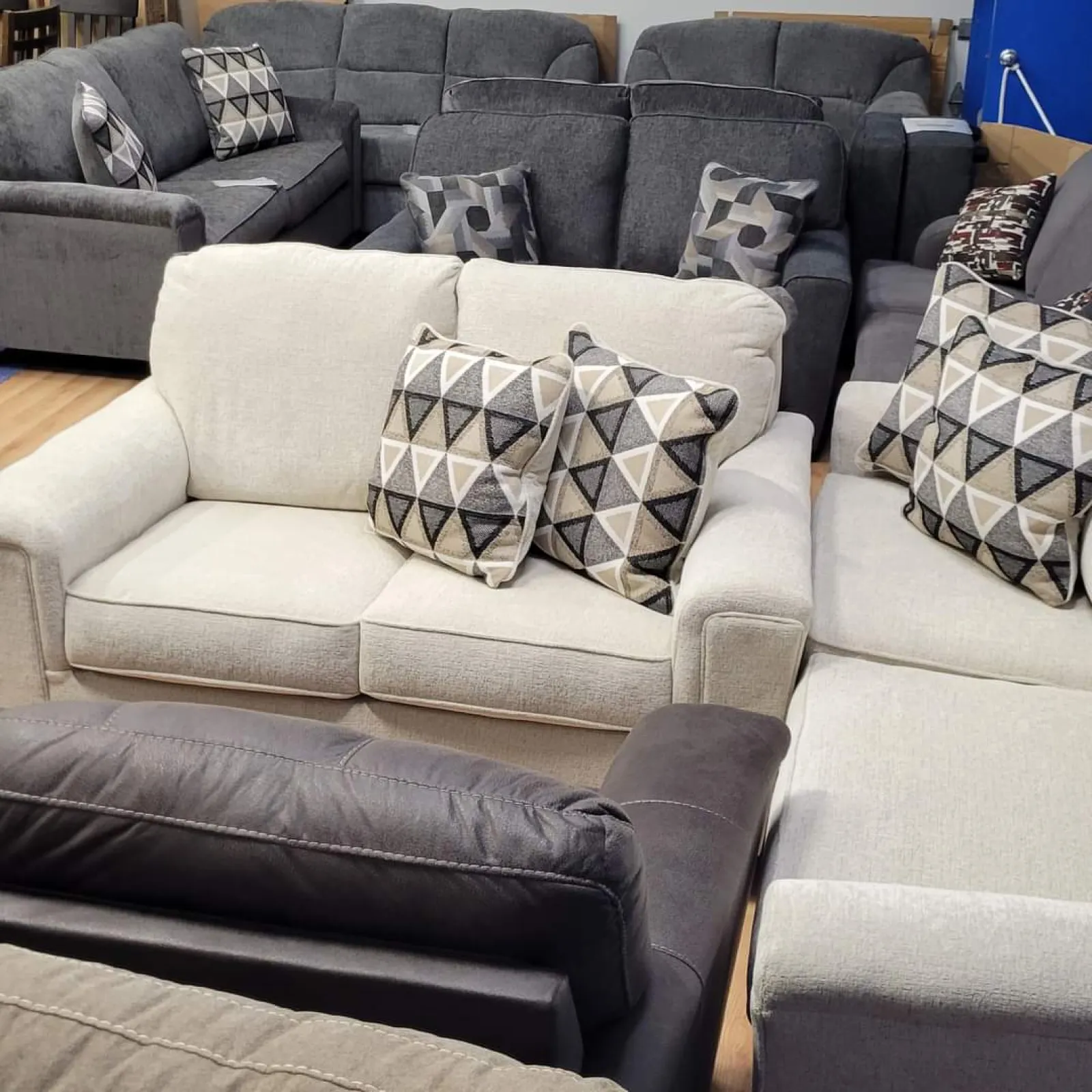 a couch with a white and black cushion