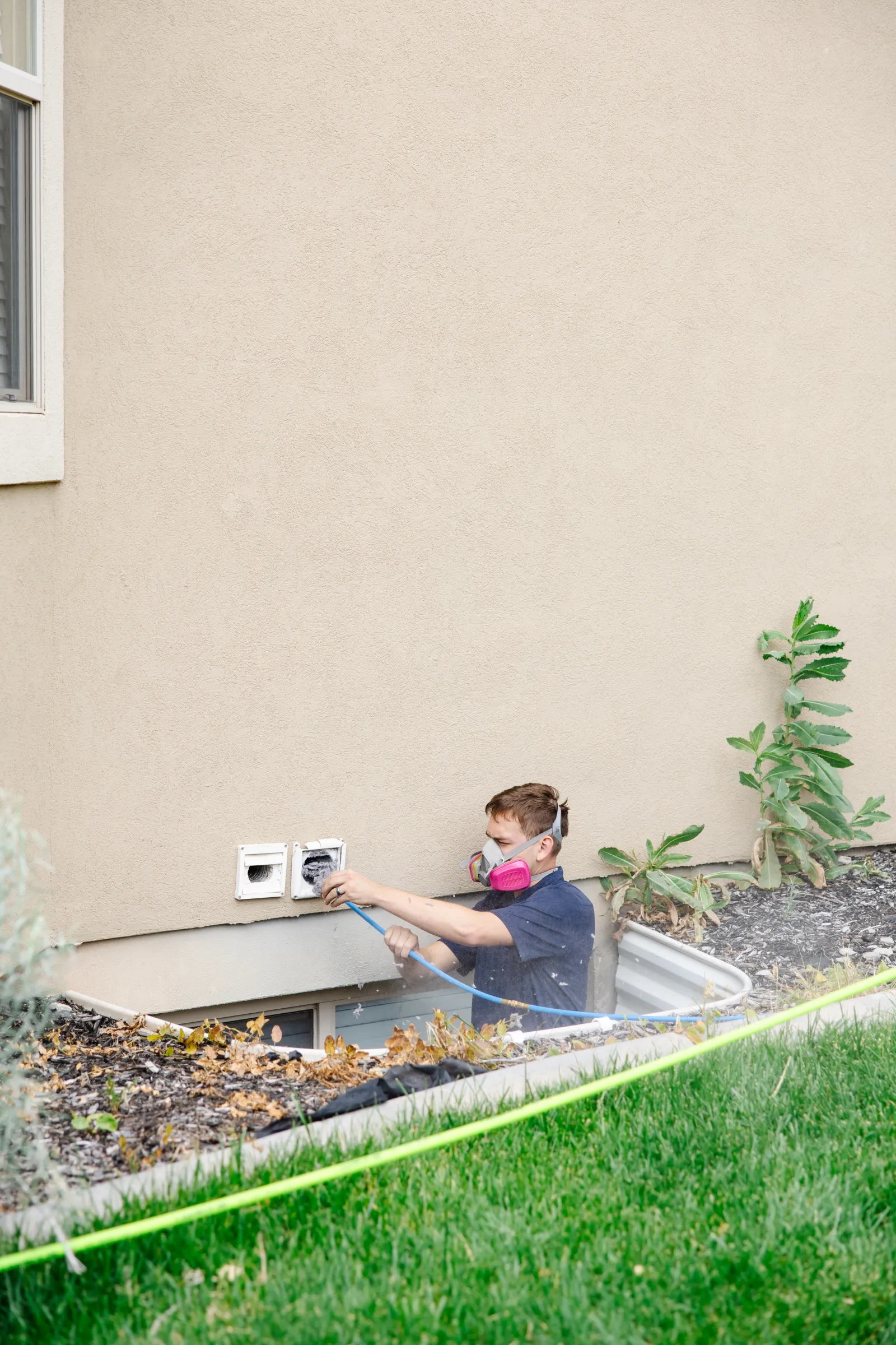 zerorez technician cleaning a dryer vent in a home