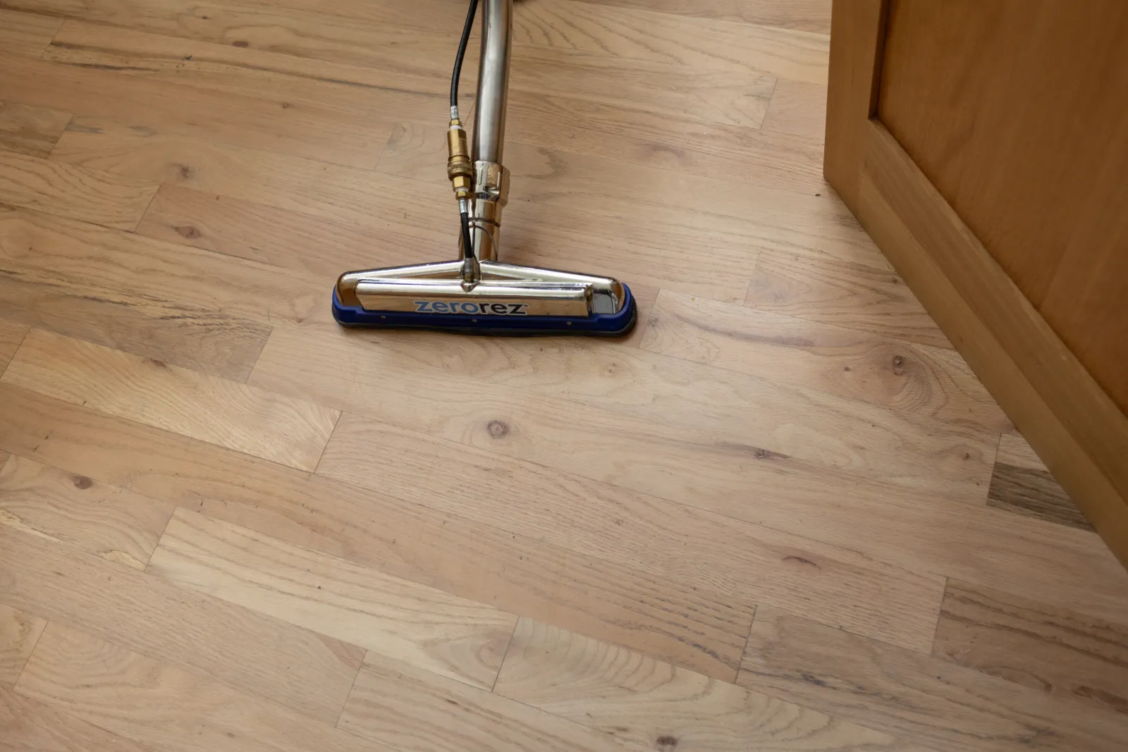 a Zerorez cleaning wand on a hardwood floor