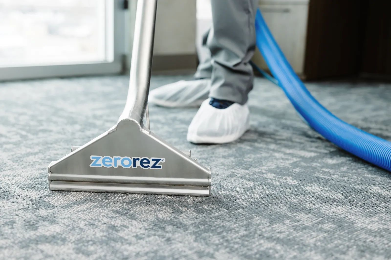 Zerorez® Zr Wand extracting and cleaning Berber carpets in a commercial office building