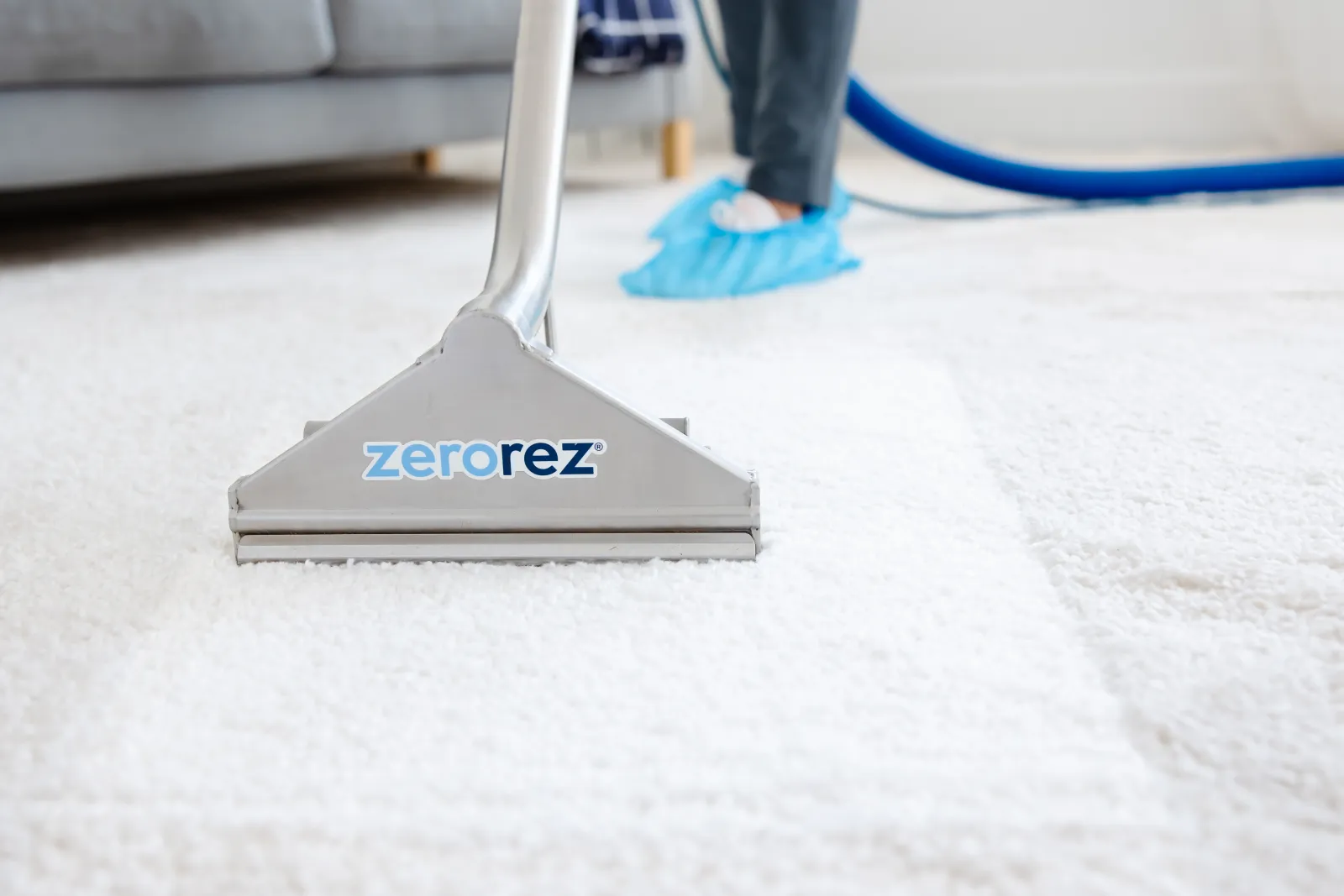 Zerorez Zr Wand deep cleaning a white carpet to extract all the particles vacuuming leaves behind