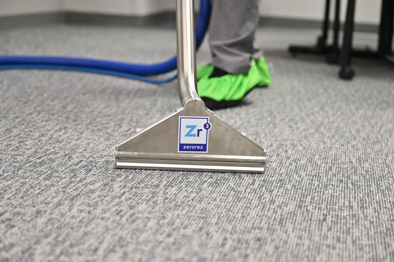 Zerorez Zr Wand being used to clean an olefin carpet in an office setting