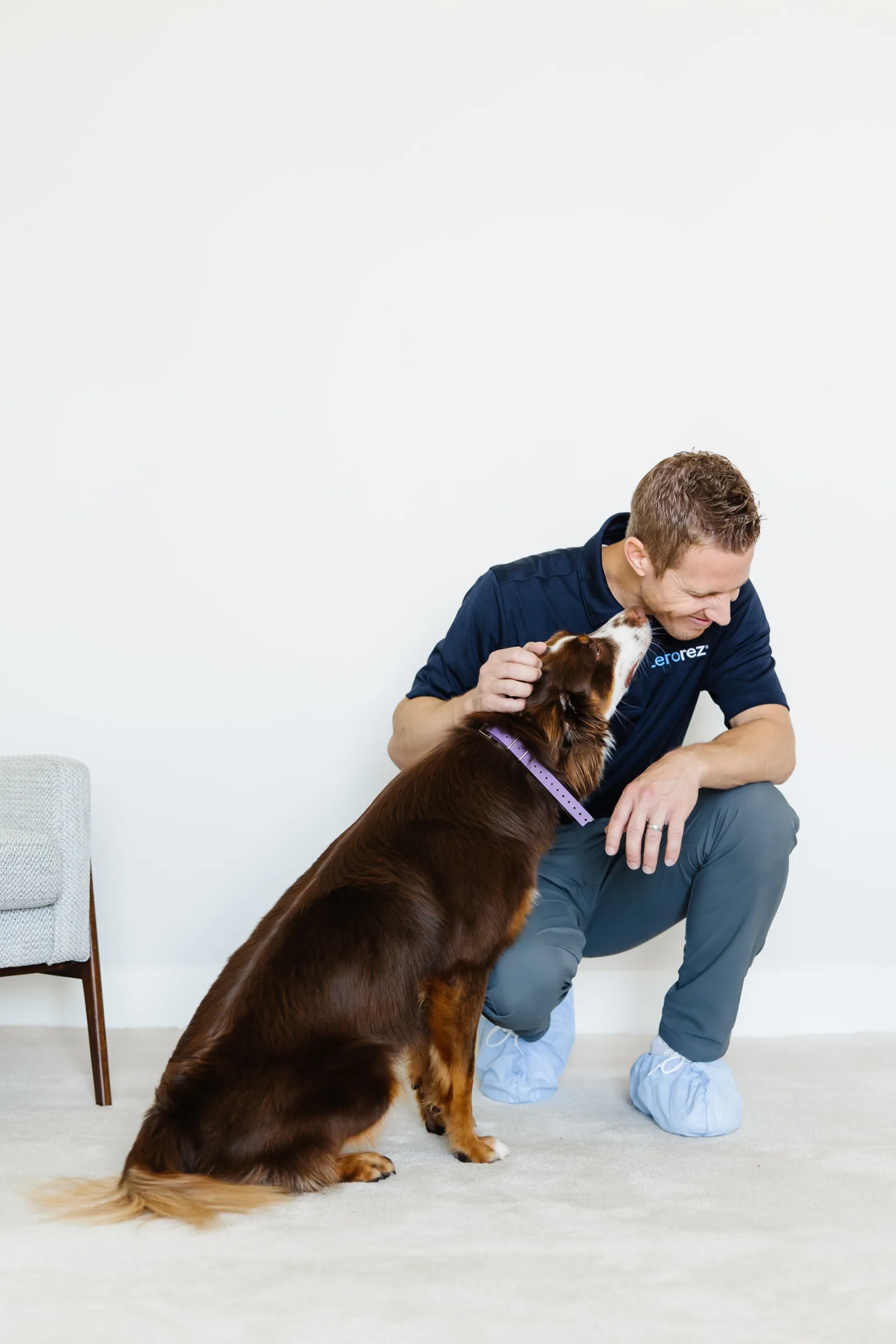 zerorez technician on white carpet with dog