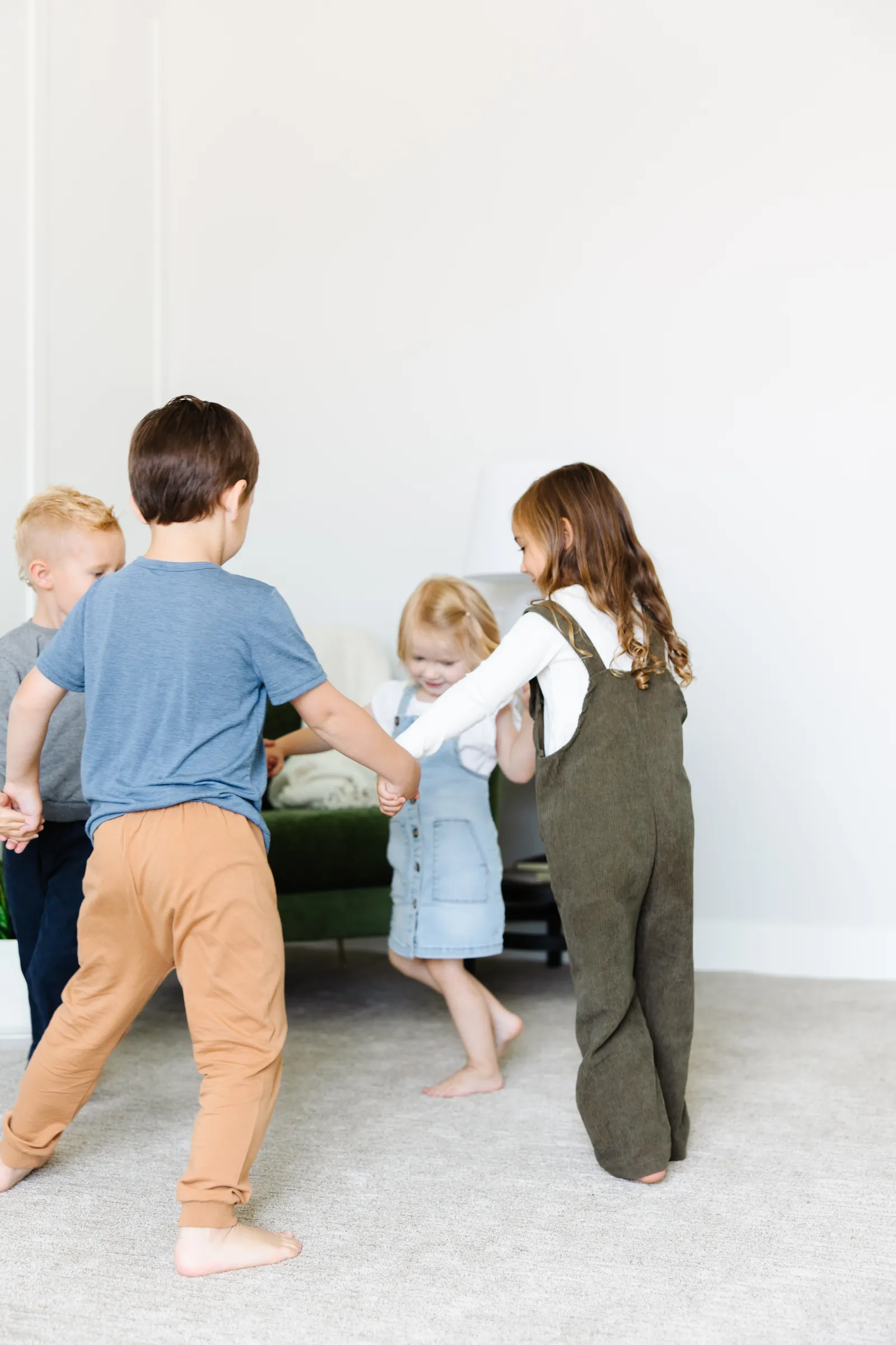 kids playing barefeet on white carpet