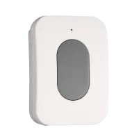 White rectangular wireless doorbell button with a gray oval center and small indicator light.