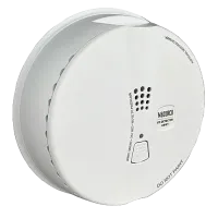 White Macurco carbon monoxide detector with vents, test button, and safety instructions on surface.